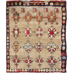Angora Turkish Tulu Carpet with Colorful Floral Designs Set on Sand Field