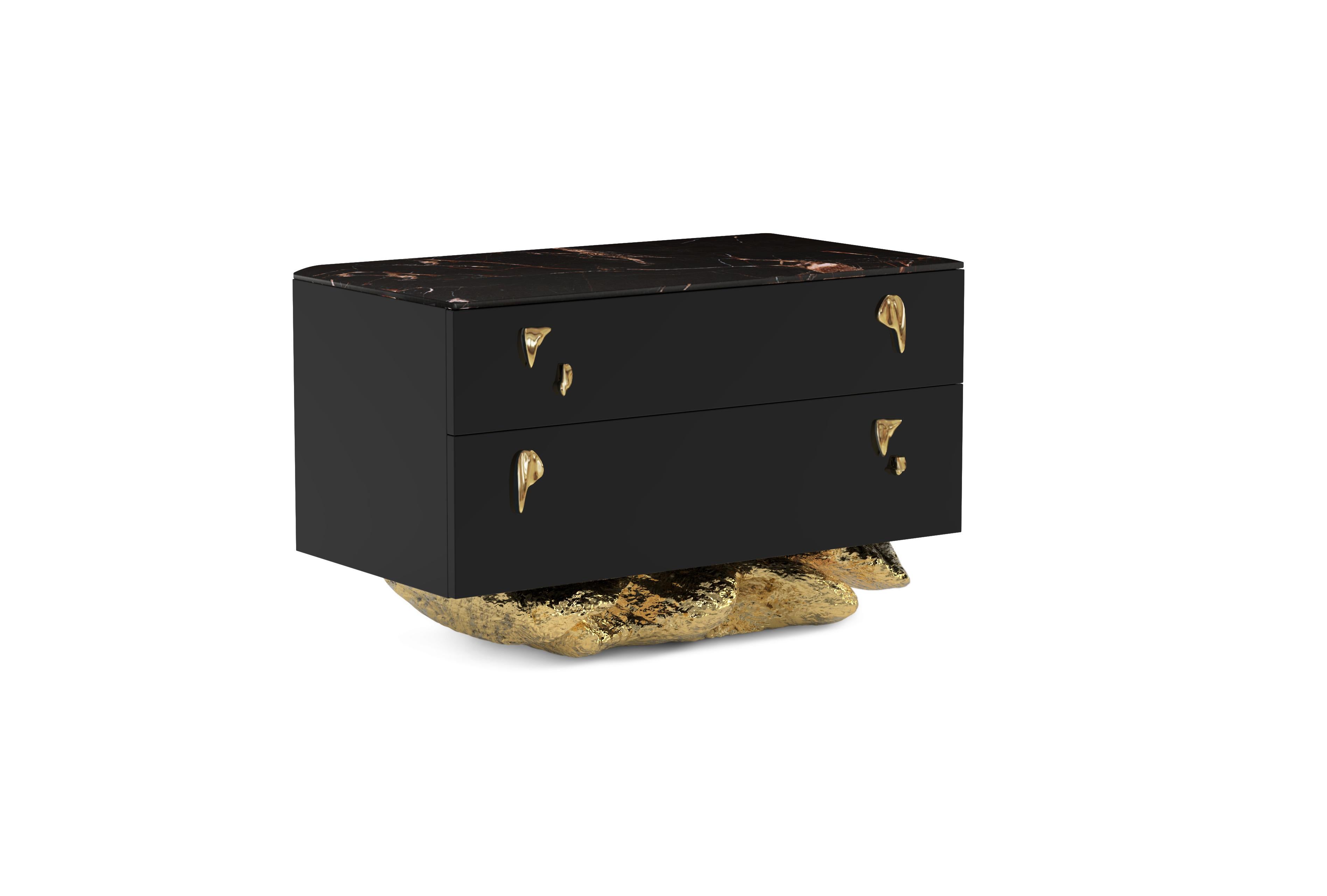 The Angra Nightstand is a harmonious blend of art and practicality. It stands gracefully atop a unique curved golden base, inspired by the enchanting cliffs of Angra do Heroismo in Portugal's Azores. This elegant piece is not just a place to keep