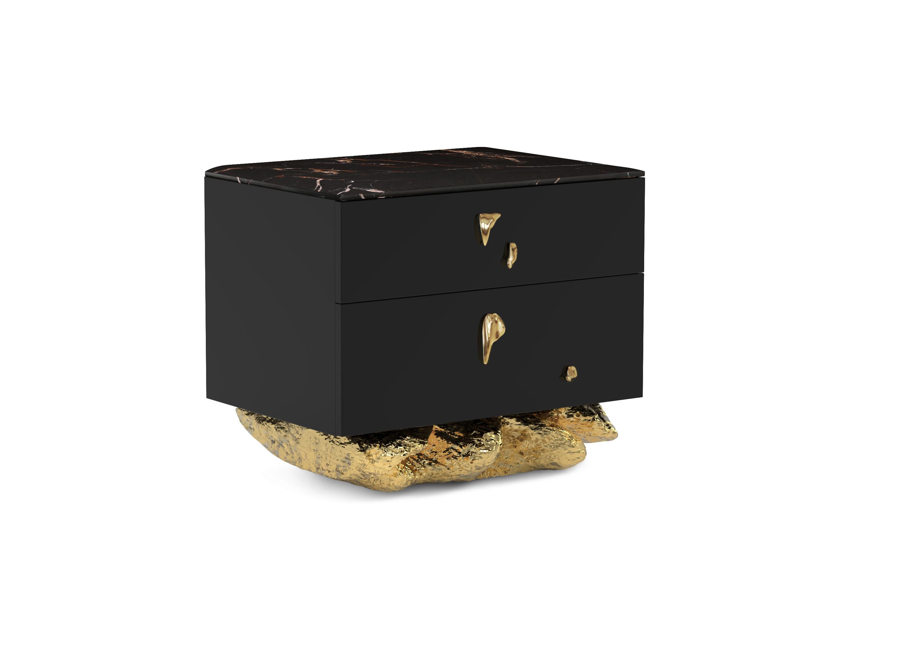 The Angra Nightstand is a harmonious blend of art and practicality. It stands gracefully atop a unique curved golden base, inspired by the enchanting cliffs of Angra do Heroismo in Portugal's Azores. This elegant piece is not just a place to keep