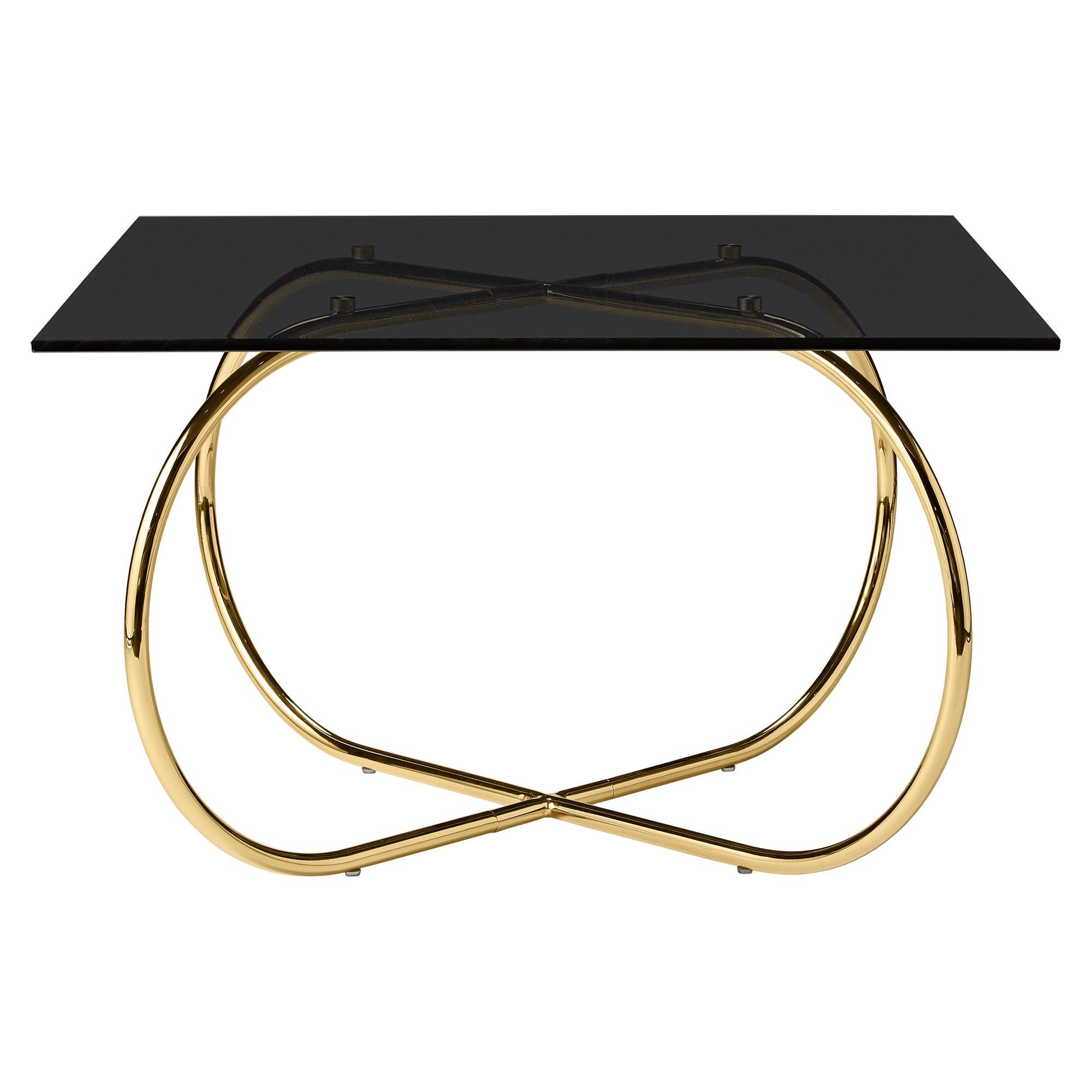 Angui golden coffee table by AYTM
Dimensions: 75 x 75 x 45 cm
Materials: Glass, copper, MDF

The Angui with its pipe style frame and light glass top will enhance the look of your living room. The Angui collection is a beautiful range of