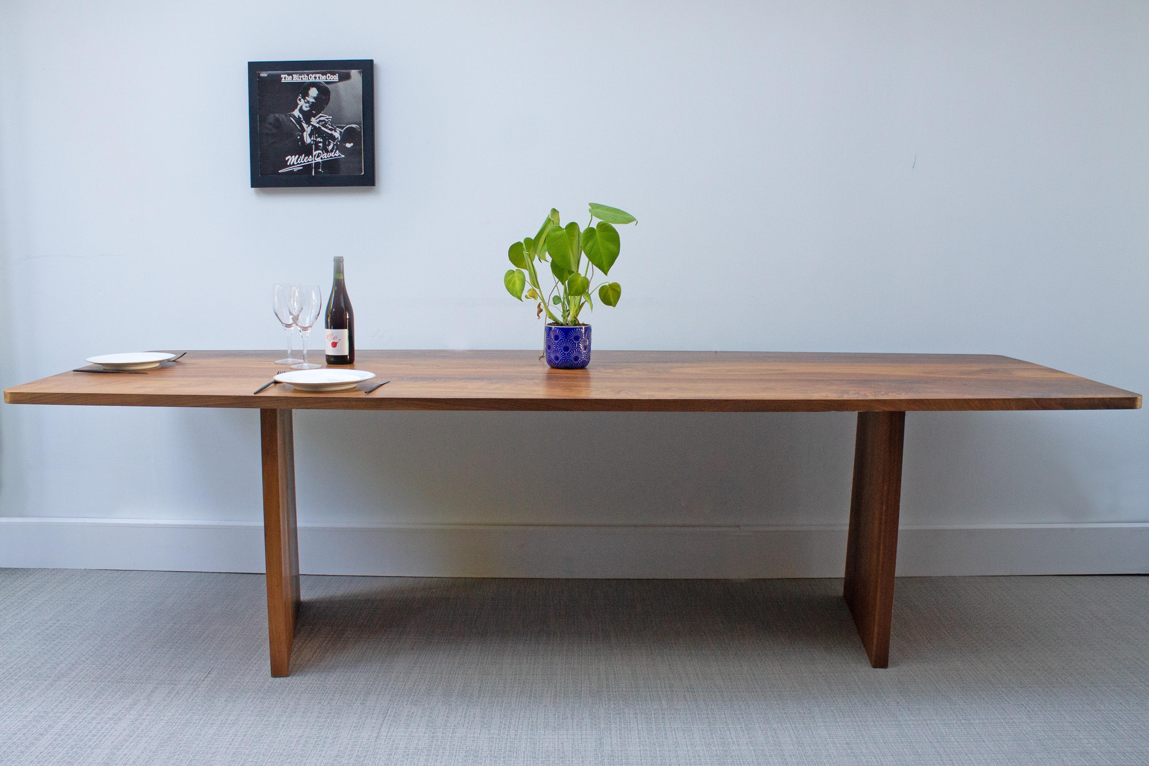 This quirky and elegant dining table has a whole bunch of angles involved in the design.

The legs are both tapered on one side and are angled at different positions. These angles create a completely different image and allow your view to