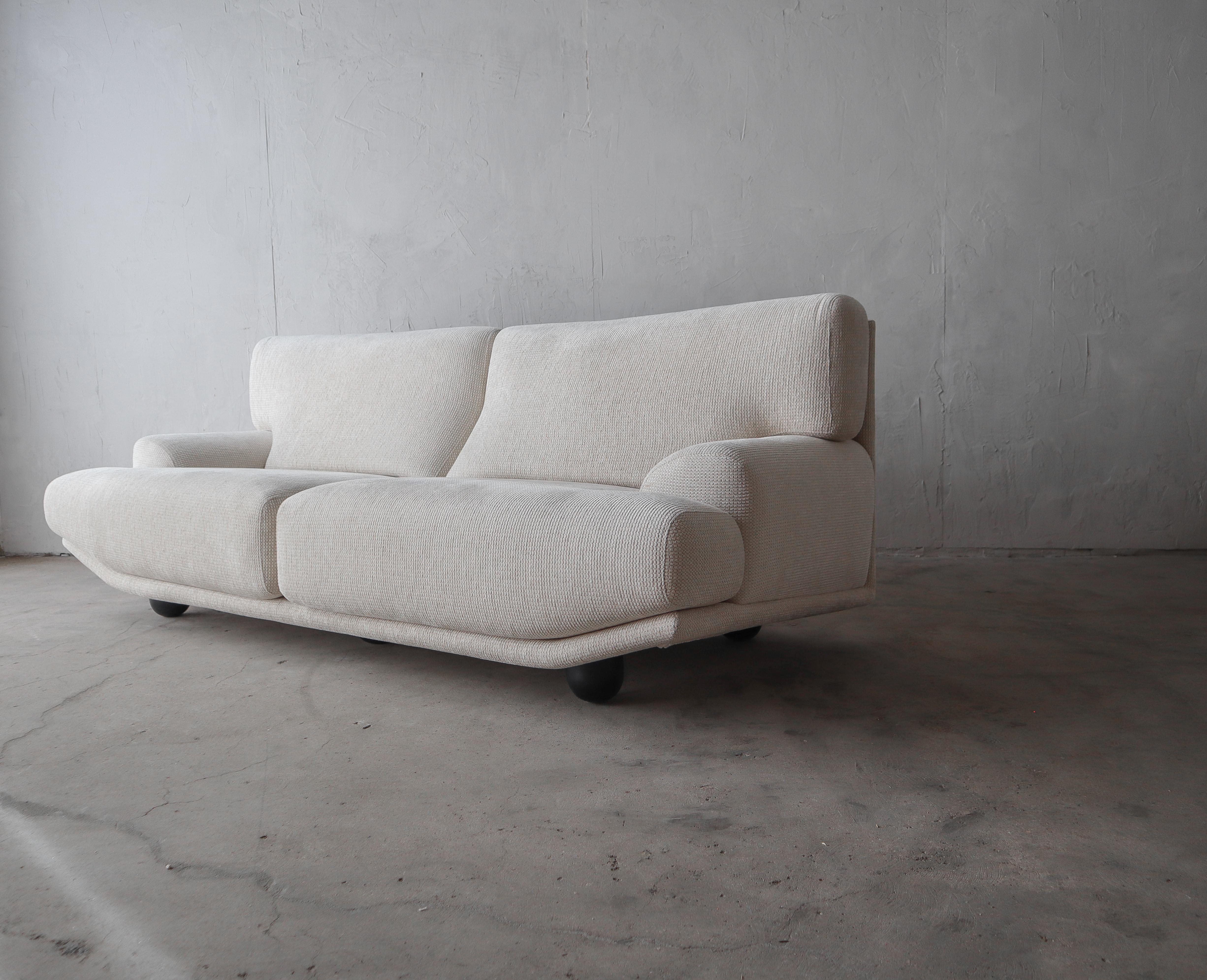 Incredible, Postmodern Italian sofa. This beauty truly has lines worth coveting. The angled frame adds visual interest. 

This sofa is in impeccable original condition, the fabric is pristine, the foam firm, it appears as if it sat untouched since