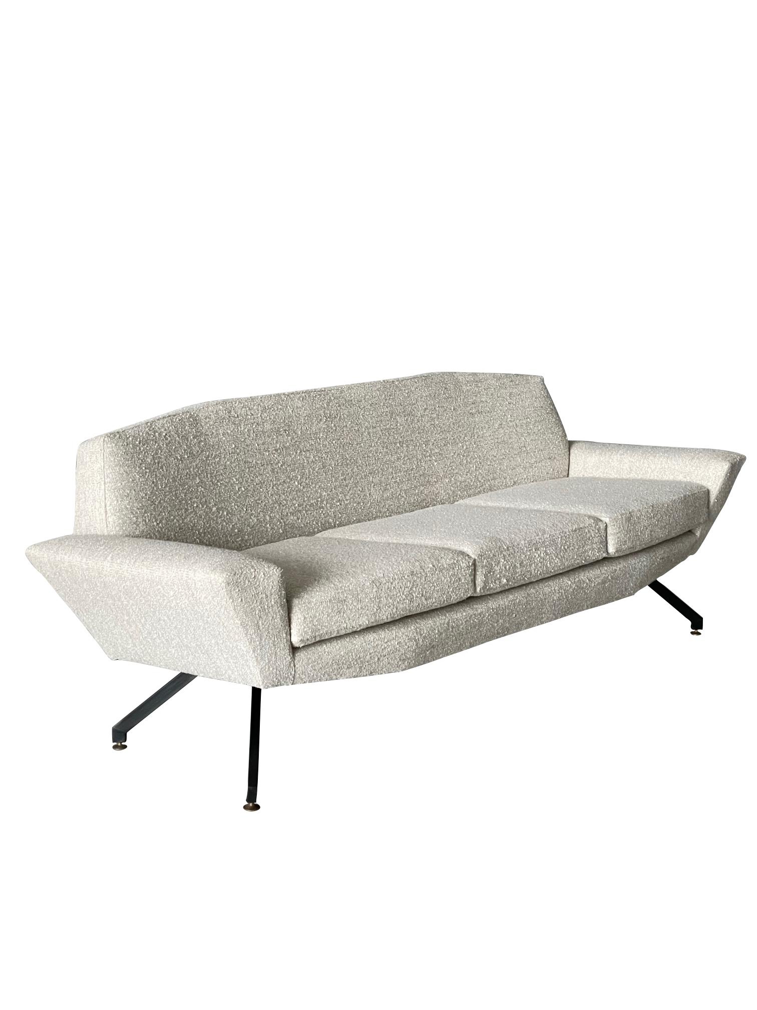 1950's Italian Lenzi sofa.
An angular sofa displaying great shape
from all angles.
This iconic sofa has been re - upholstered in quality
wool/linen fabric.
Signature metal legs.
Very comfortable and stylish.
Also available pair of matching