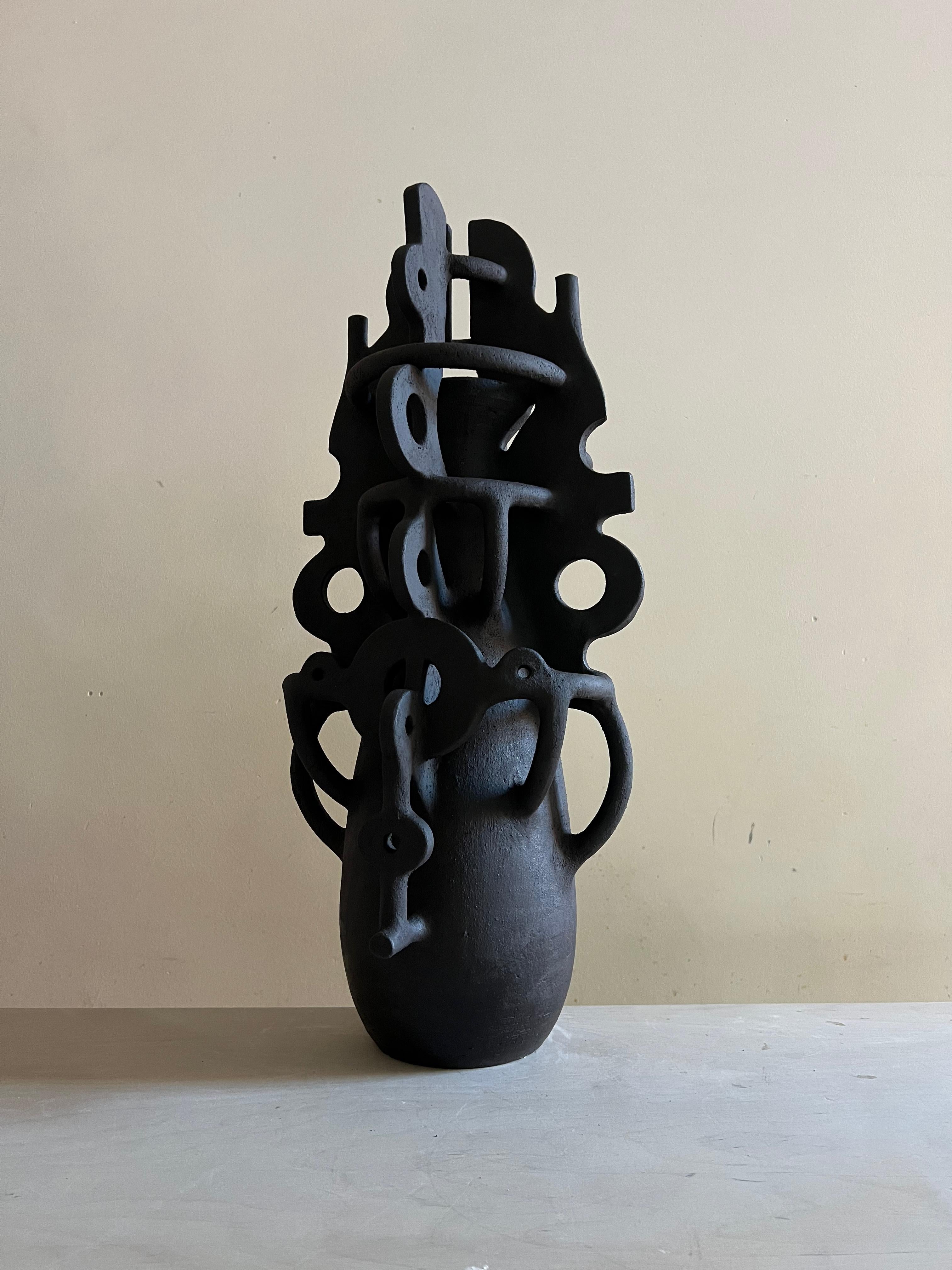 Inspired by architecture and imagined civilizations, these handmade sculptures evoke strength, stability, and timelessness. Each earthy, one of a kind piece becomes a symbol—a fortress, an altar, a relic of unknown rituals. The artist plays with