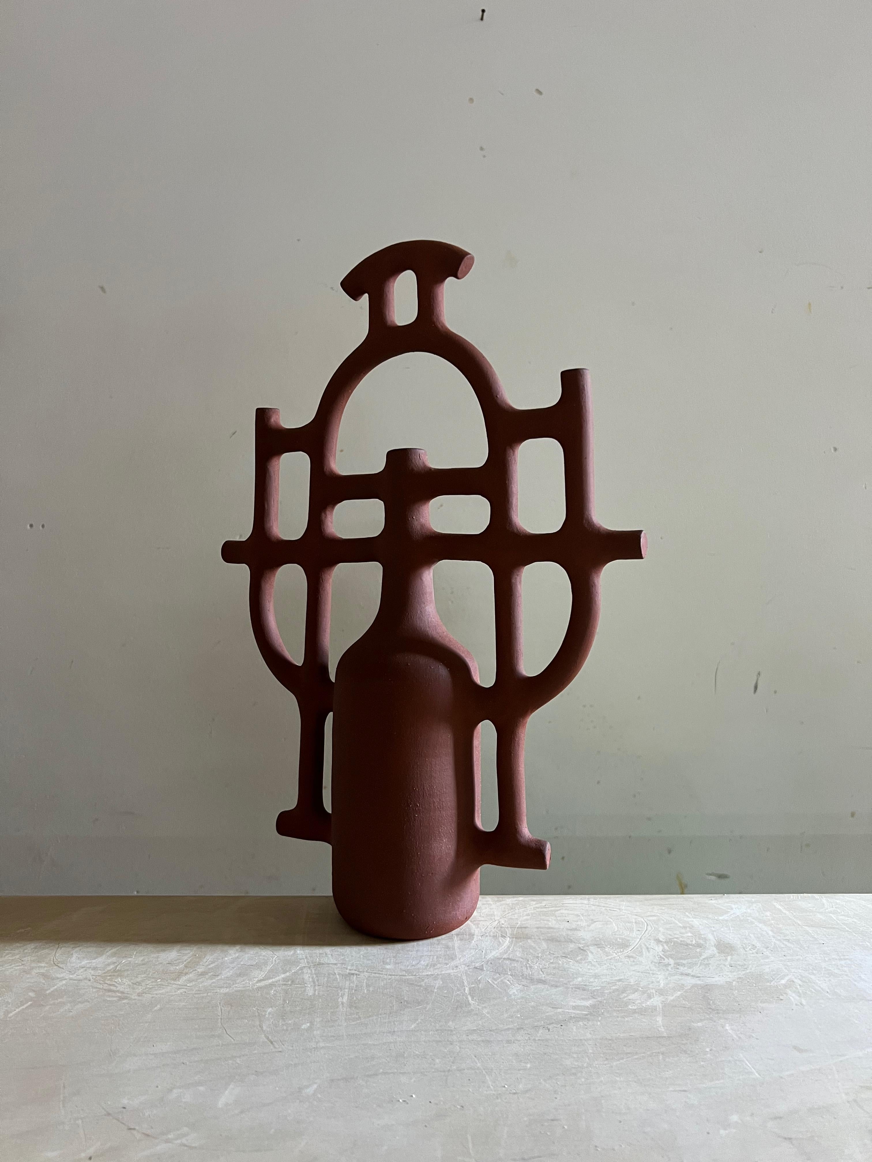 One of a kind, handmade earthy sculptures inspired by traditional Spanish ceramics and classical utilitarian forms. Raw, unglazed, solid. Shapes are simple and bold, echoing campanario water jugs and ornamental filigree. The artist blends