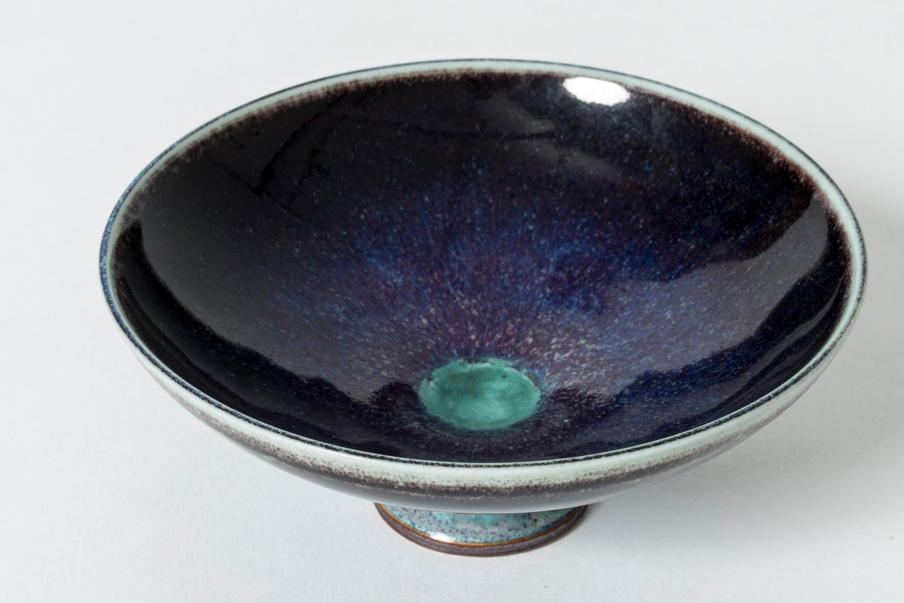 Beautiful miniature stoneware bowl by Berndt Friberg, glazed with “Aniara” glaze. Rich purple blends elegantly with bright aquamarine tones.