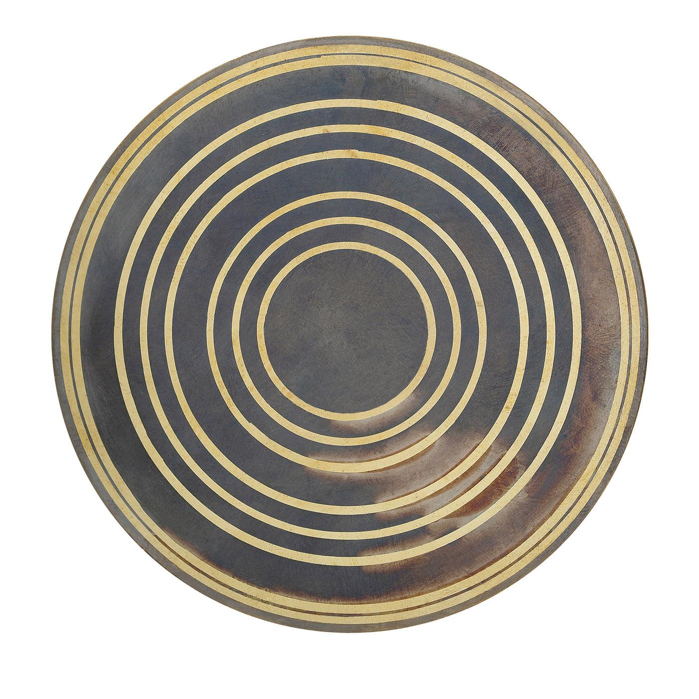 A clever use of oxides on brass lends this set of six coasters an outstanding abstract look defined by concentric elements inspired by the Aniconism, or the opposition of visually depicting living and supernatural creatures. Their backs are covered