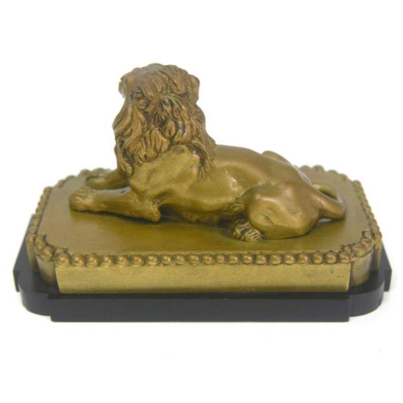 Bronze lion with gilded patina, early 20th century, mounted on a marble base measuring 11 cm high for a length of 17 cm and a depth of 10 cm.

Additional information:
Material: Bronze
Artist: Clovis-Edmond Masson (1838-1913).