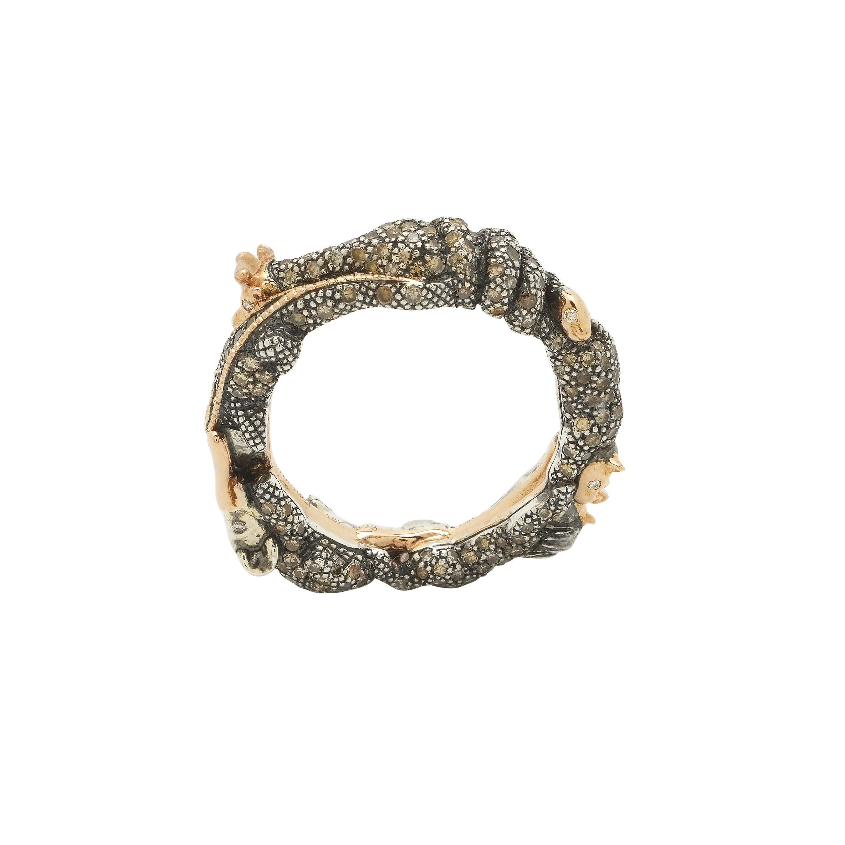 An elegant circle of life, the Animal Eternity Ring is fashioned as an intertwined knot of animals, among them a snake, a lion, and a ram. Designed in 18k recycled rose gold and sterling silver, these finely-crafted animals have twinkling white