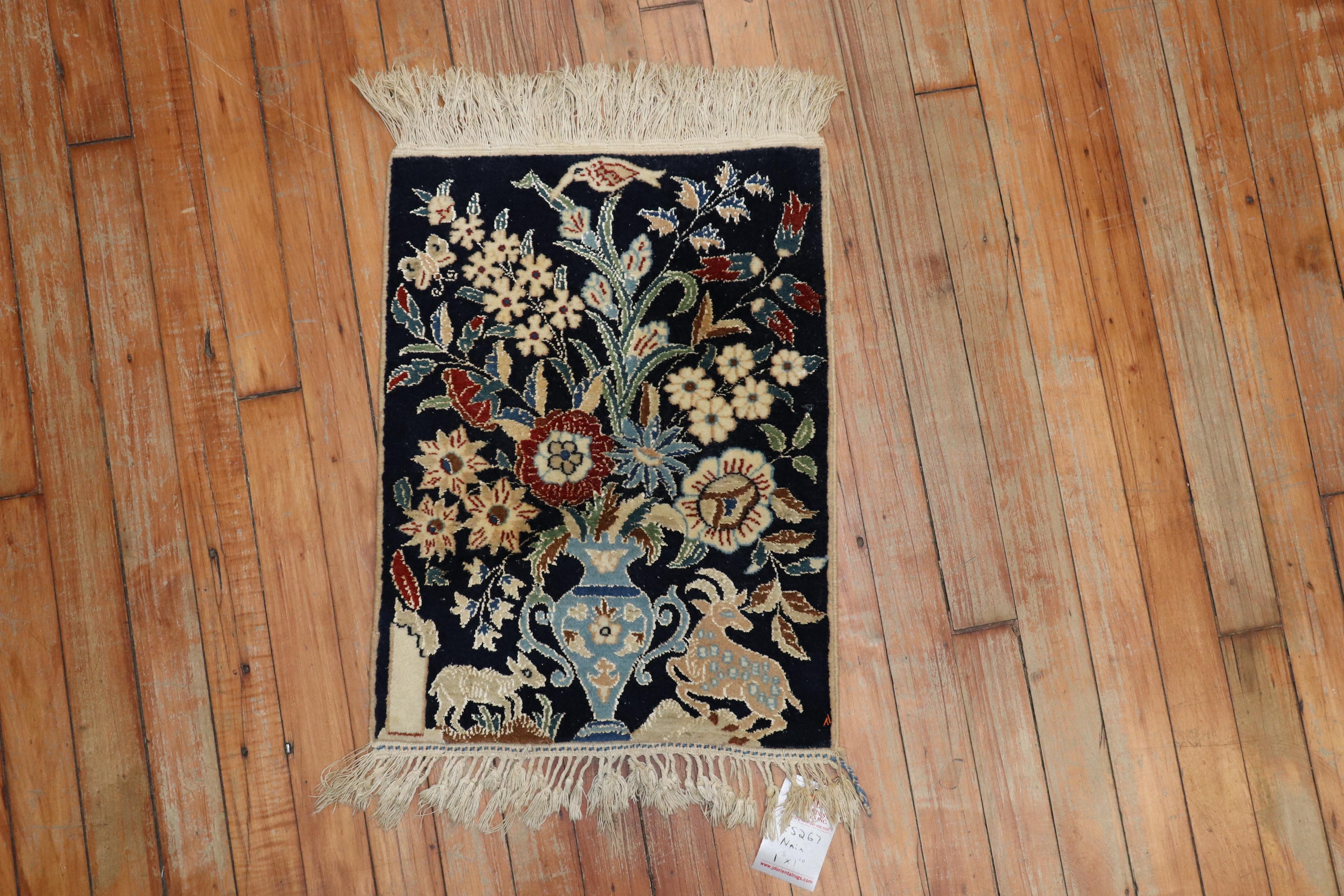 One of a kind mid-20th century highly decorative caliber Pictorial Persian Nain rug with a animal floral motif on a deep blue field.

Measures: 1'3
