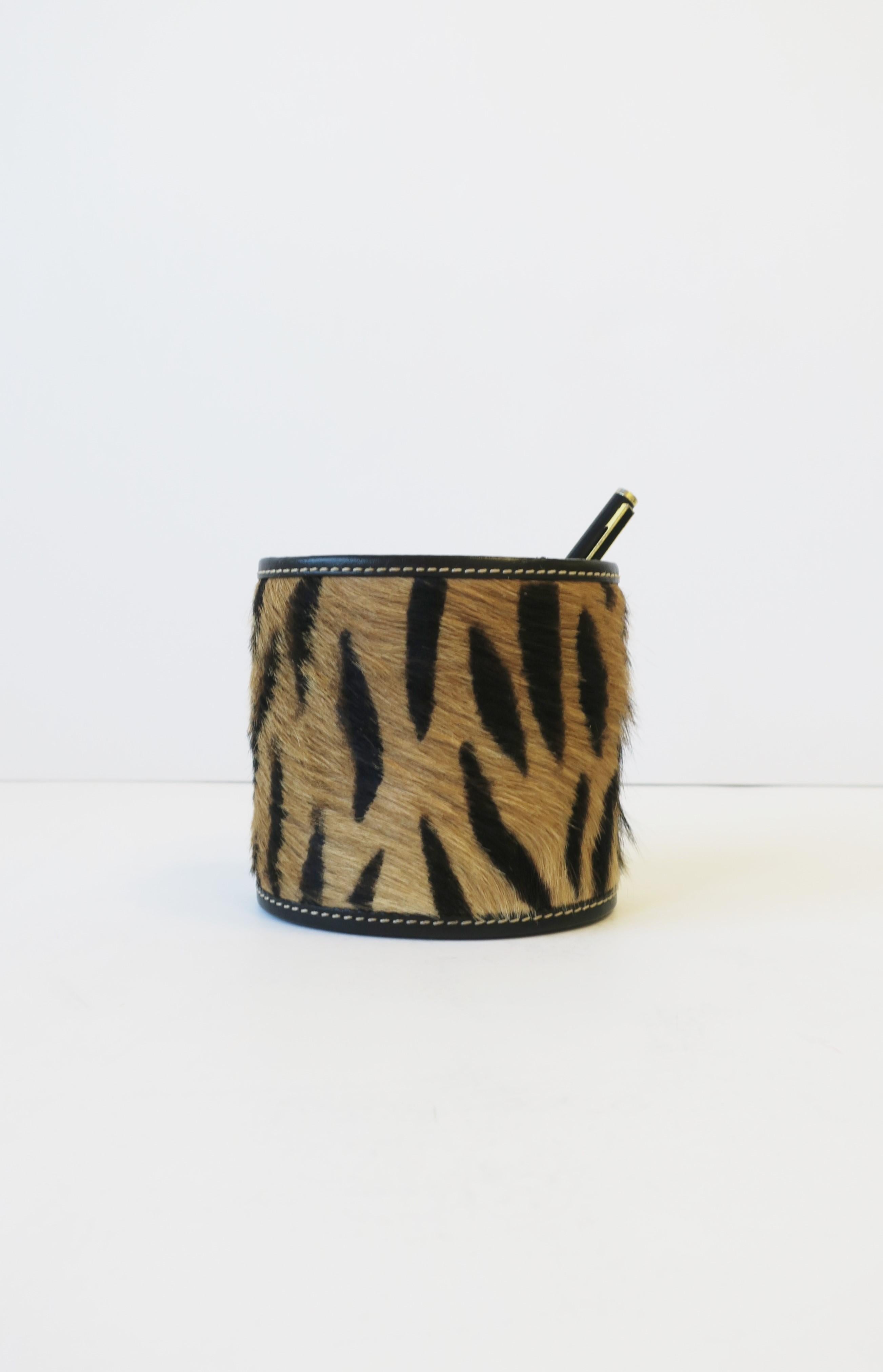 Authentic animal hide 'tiger-esque' oval pen or pencil holder with red velvet interior, circa 1990s, late-20th century. A great desk organizing piece/accessory. Colors include: tan, black and red. 

Piece measures: 3