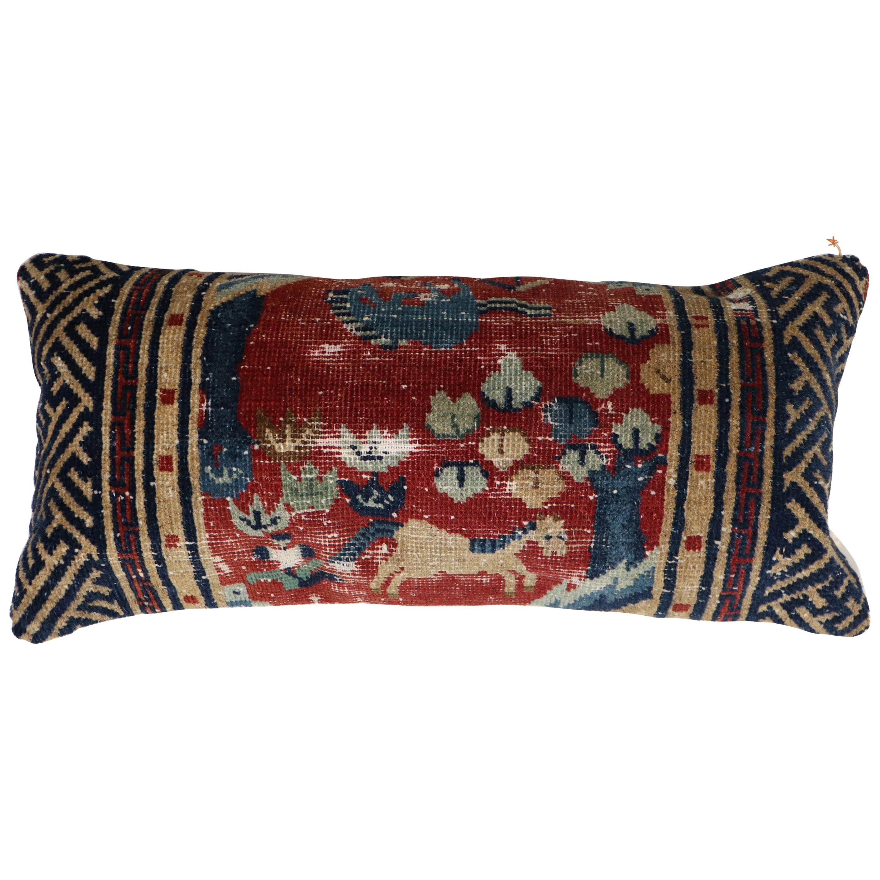 Bolster size pillow made from a mid-19th century animal motif Tibetan rug in red blue and camel. Backed in cotton, zipper closure provided too.

Measures: 12