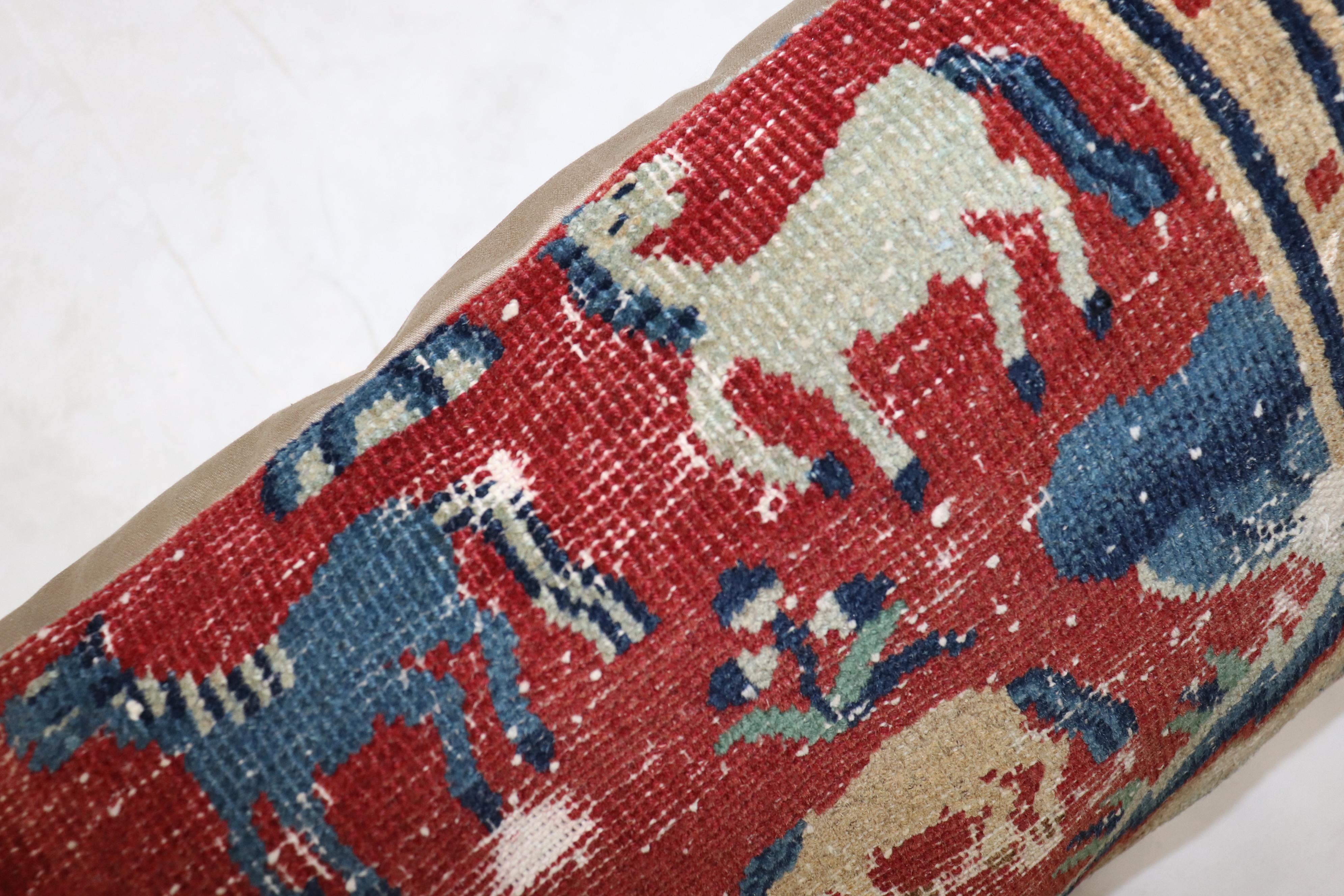 Bolster size pillow made from a mid-19th century animal motif Tibetan rug in red blue and camel. Backed in cotton, zipper closure provided too.

Measures: 16