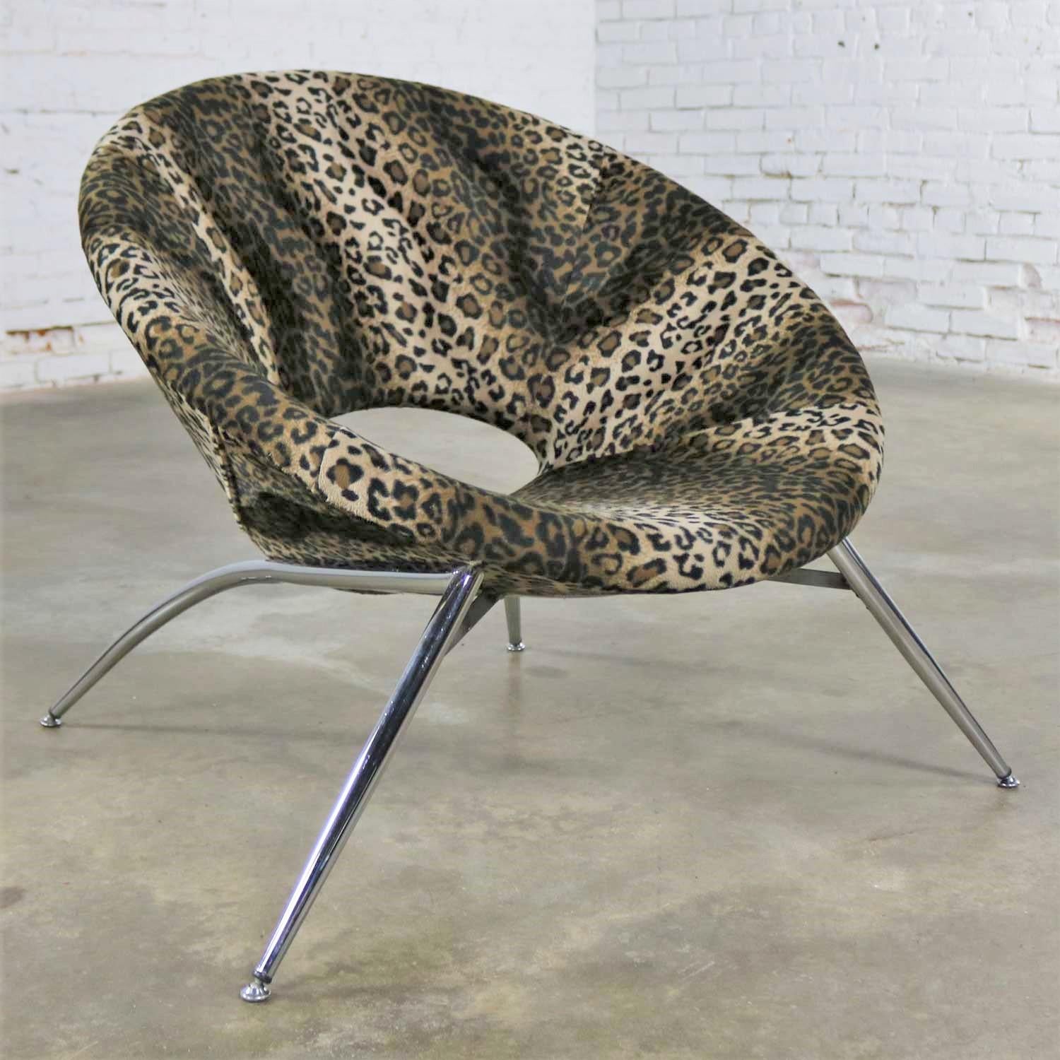 Fabulous round hoop, bucket, or tub chair upholstered in animal print fabric with chrome legs and made in Italy. It is in wonderful condition and ready to use, circa late 20th century.

Whoa! Now that’s Italian! This is one excitingly beautiful