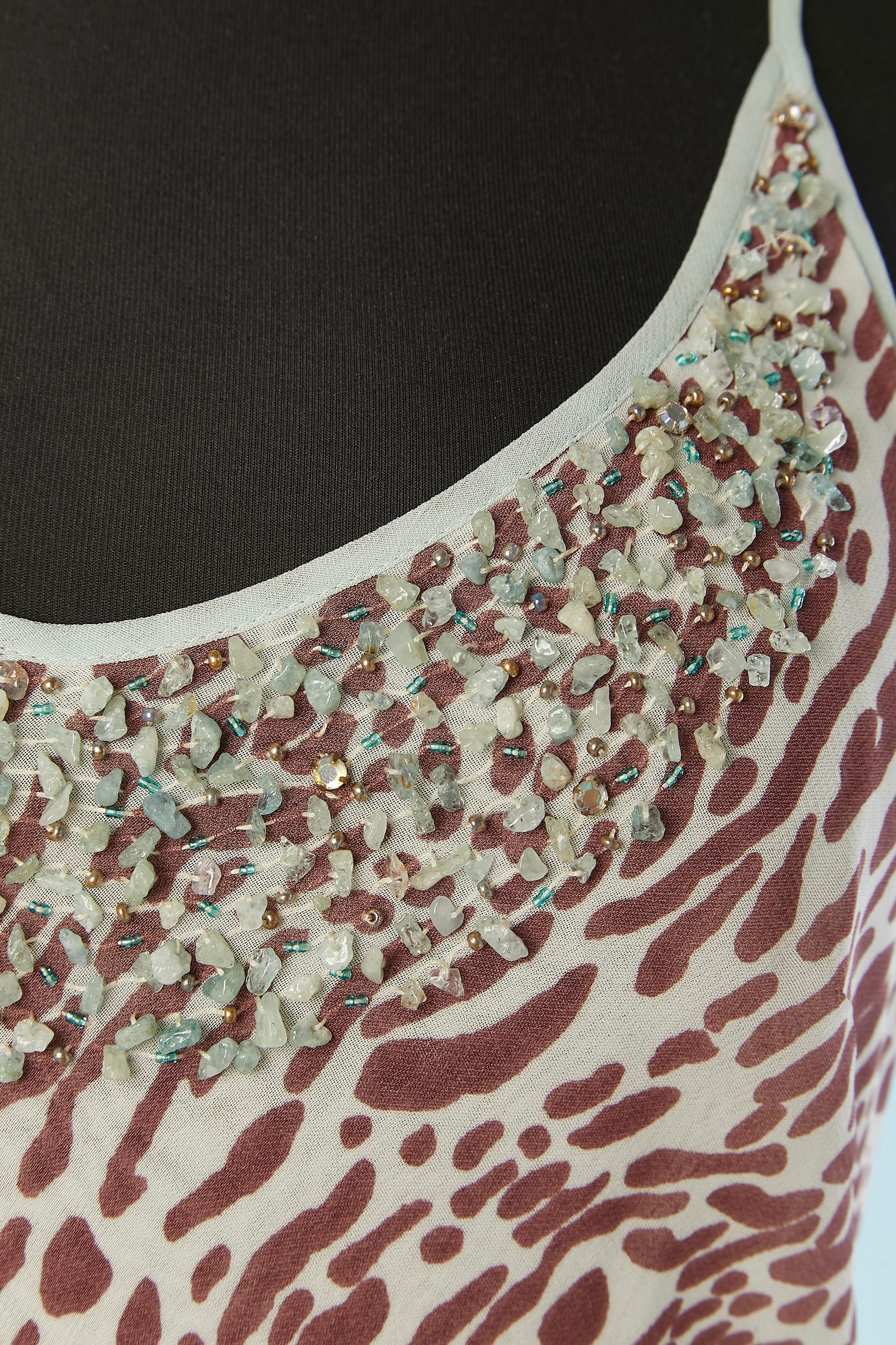 Animal print evening dress with beadwork around the neckline.
Fabric composition: rayon
Biais. Narrow ruffle bottom edge. 
SIZE 44 (It) 40 (Fr) M 