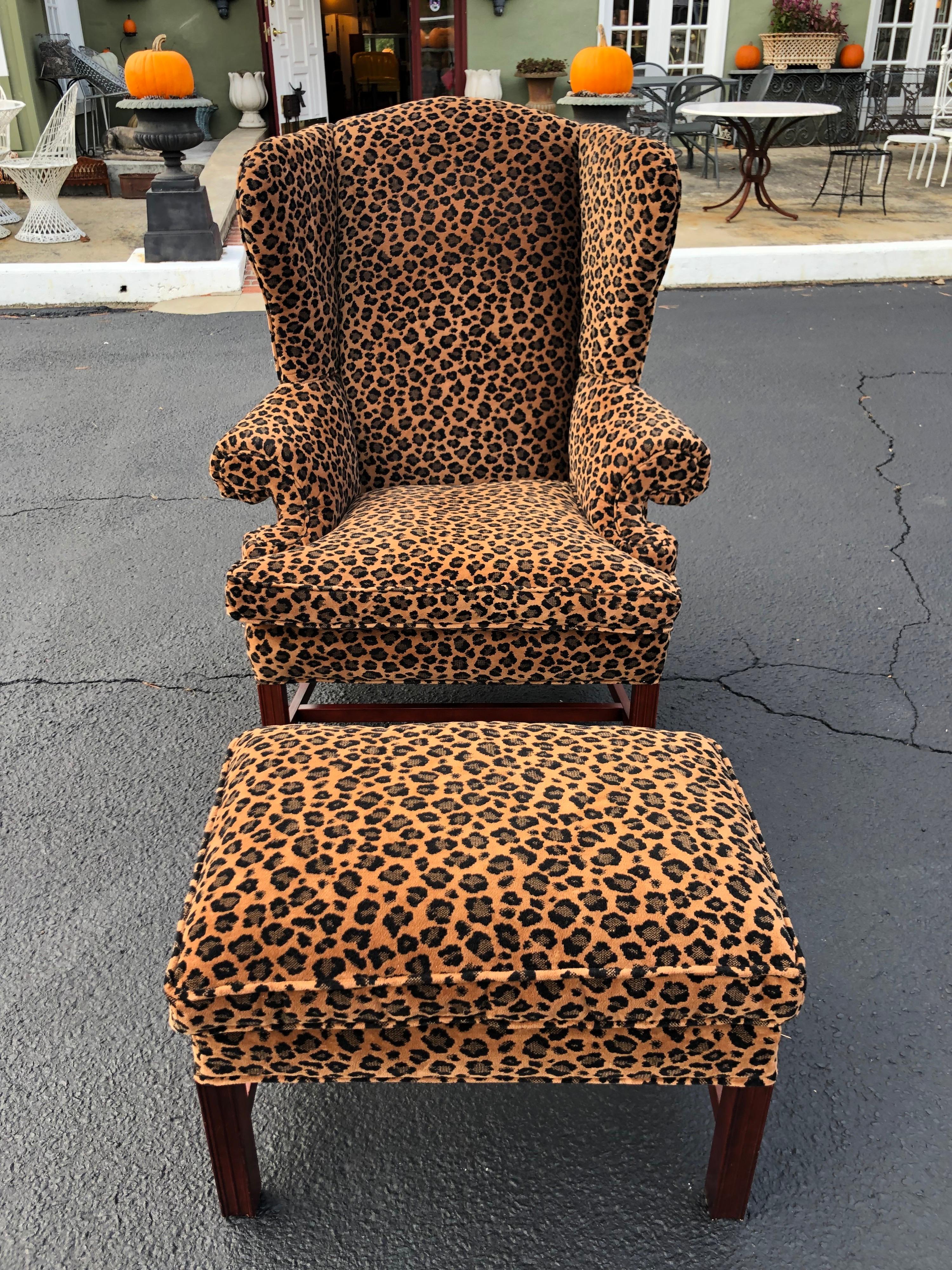 Animal print wingback chair and ottoman. Amazing statement piece as well as ultimate in comfort. Sink into this luscious velvet like upholstery and put your feet up. Traditional wooden base in stained mahogany. Puur-fect for that animal lover or