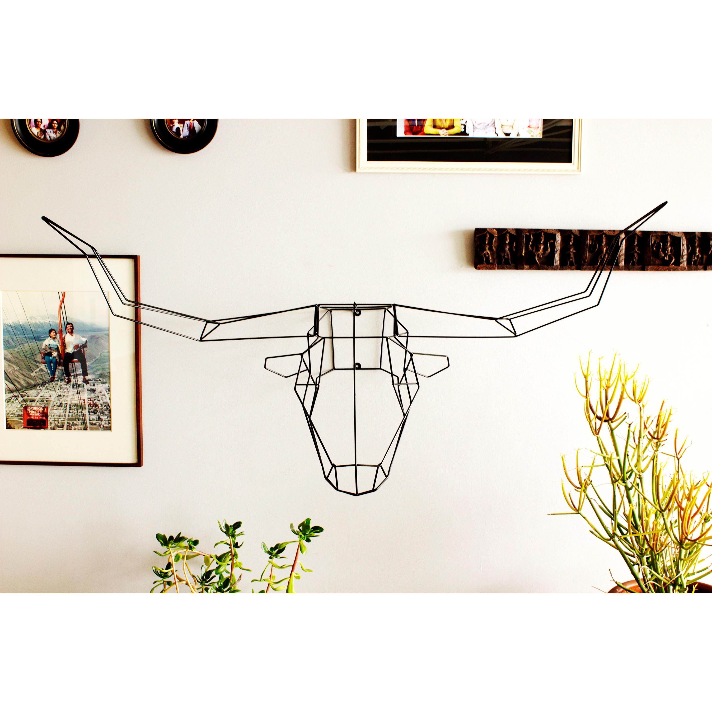 The longhorn is the largest in the animal sculpture collection and will add a wild feel to any space. This wire design is made to mount on your walls or sit atop a shelf.
Copper and gold finish for indoor use only.

  