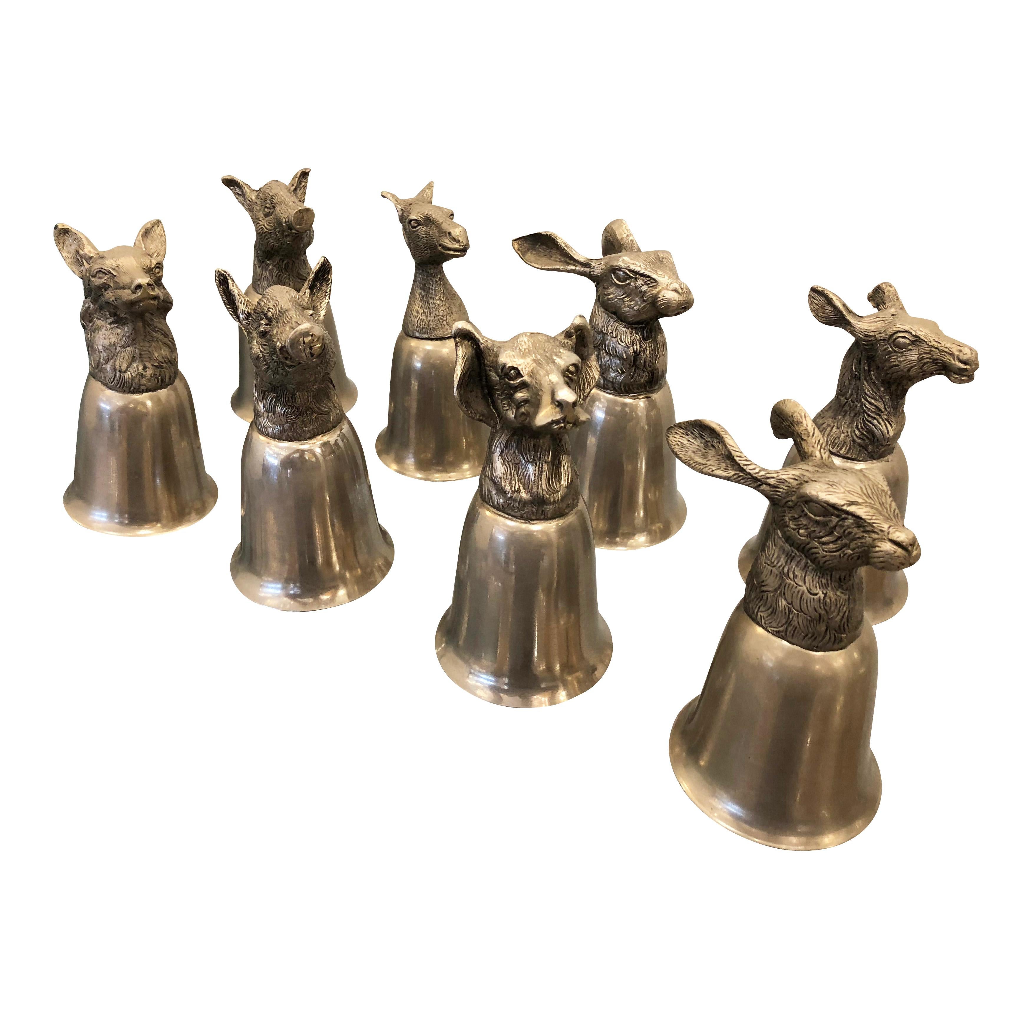 Set of eight playful stirrup cups from the 1970s attributed to Gucci. They balance with the animal heads up or down and can just be used as decorative objects if desired. The set includes two hares, two boars, one horse, one dog, one dear and one