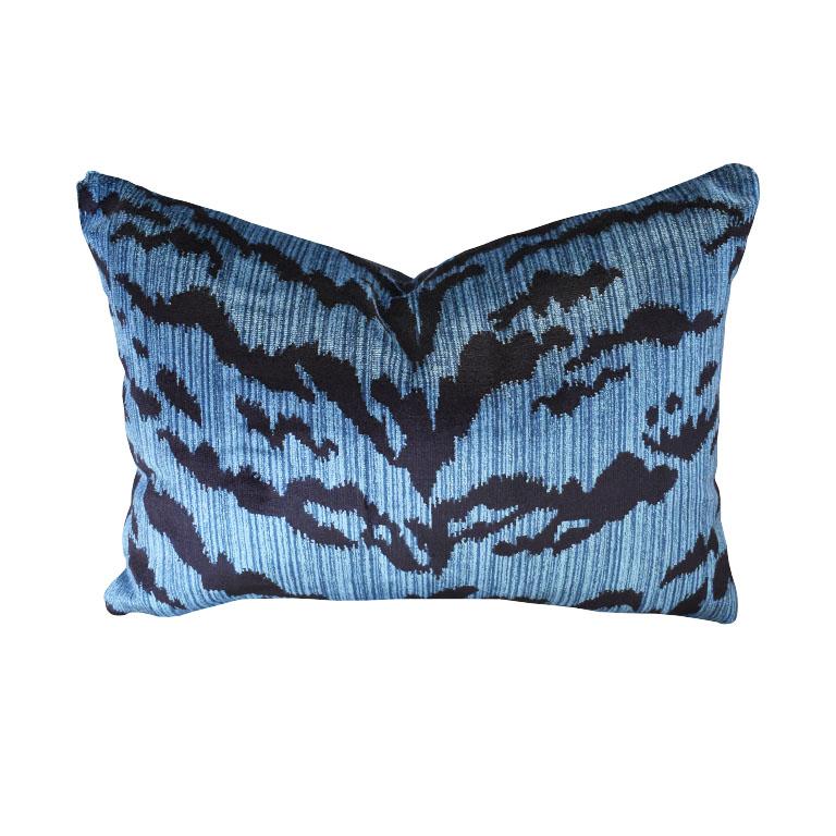 An animal motif tiger print lumbar pillow in navy blue and black. Multiple available. The front features a gorgeous thick velvet animal print in blue and black velvet. The back features crisp black linen. Each pillow is down-filled with a knife edge