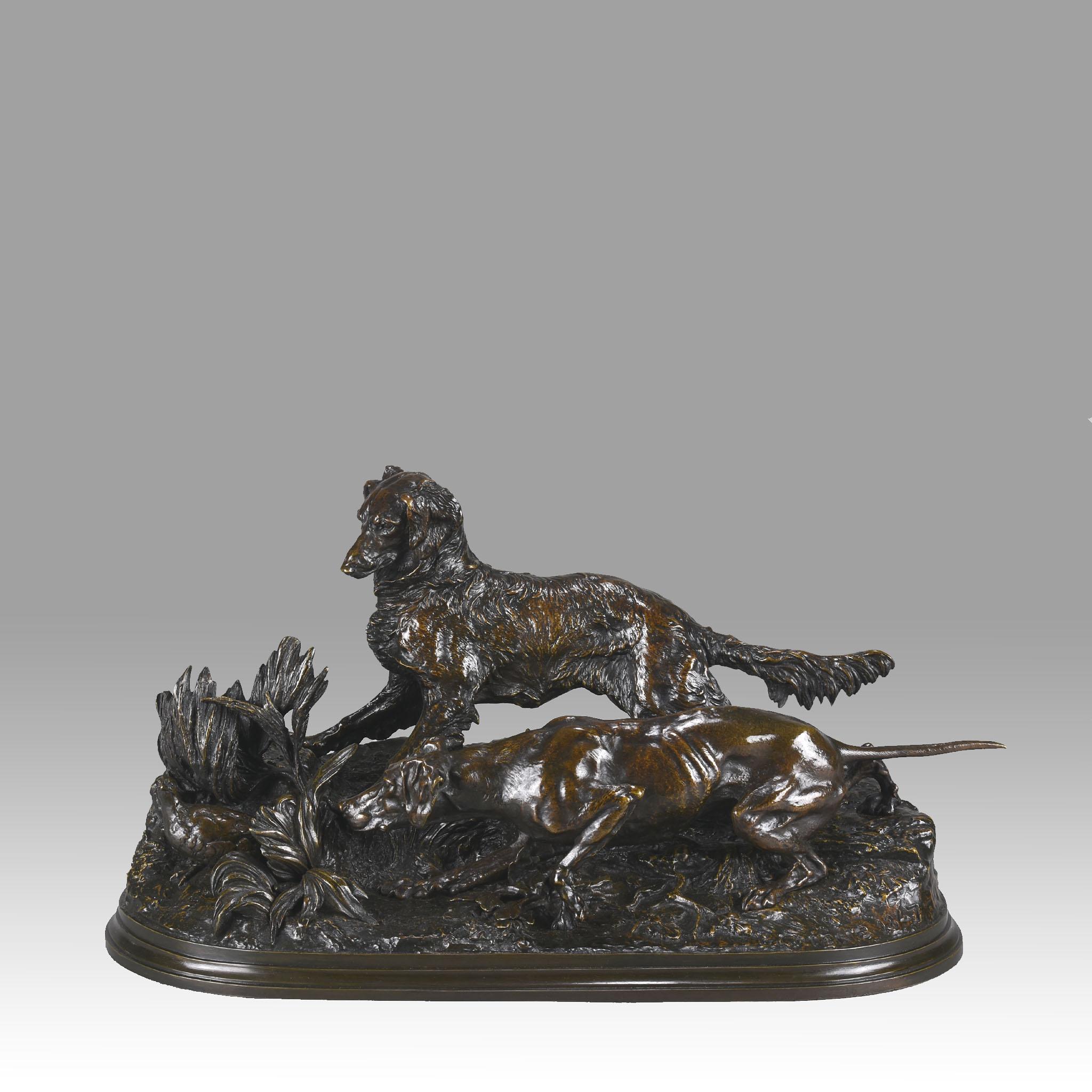 A fabulous Mid-19th Century French animalier bronze study of two hunting hounds, a setter and a pointer, flushing a partridge in the undergrowth. The bronze with very Fine deep brown lightly rubbed to yellow patination and excellent hand chased