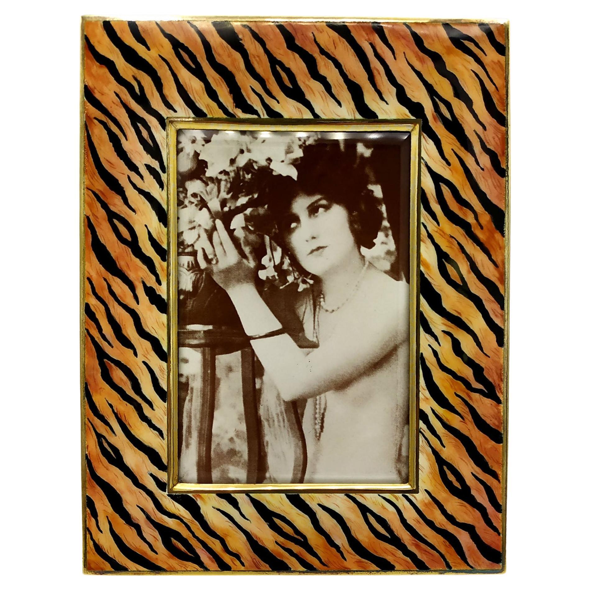 Rectangular frame in 925/1000 sterling silver gold plated with hand-painted fired enamel spotted tiger fur type in a modern contemporary style. External measurements cm. 14 x 17.5, internal cm. 7.5 x 11. Weight gr. 345. Designed by Franco Salimbeni