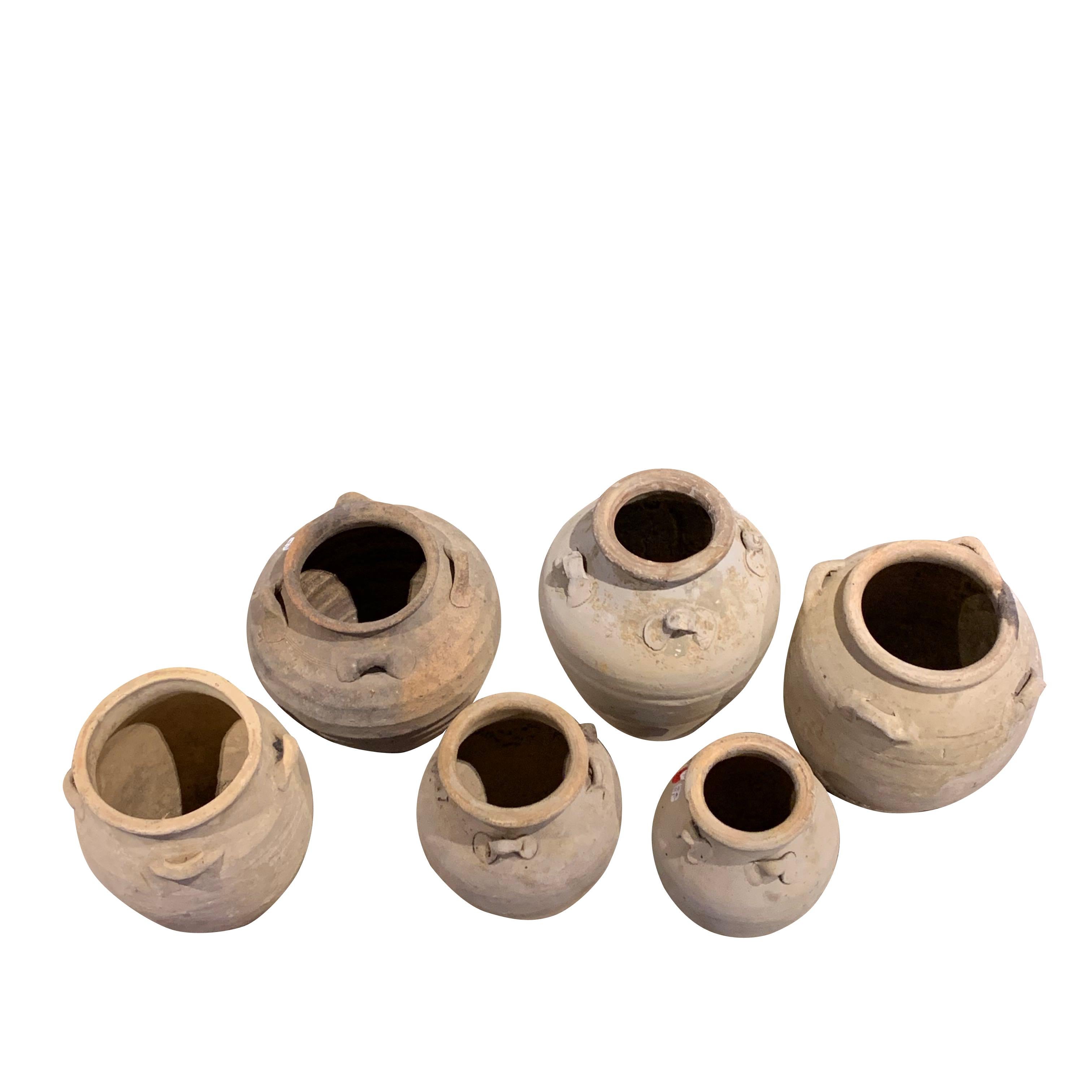 16th century Vietnamese collection of terracotta animist ship wrecked vases.
Natural weathered patina
Sizes range from 5