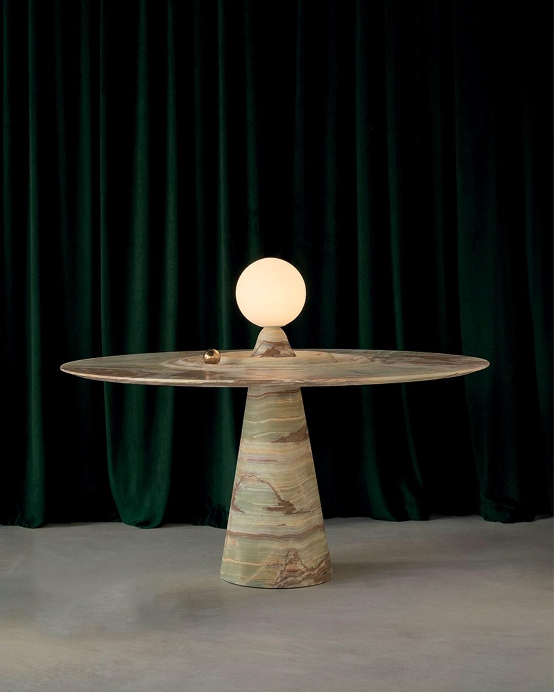 The ANIMO table is meticulously crafted to blend the timeless allure of natural materials with innovative design. More than just a piece of furniture, it stands as a statement of sophistication and artistic ingenuity. Carved from a single block of