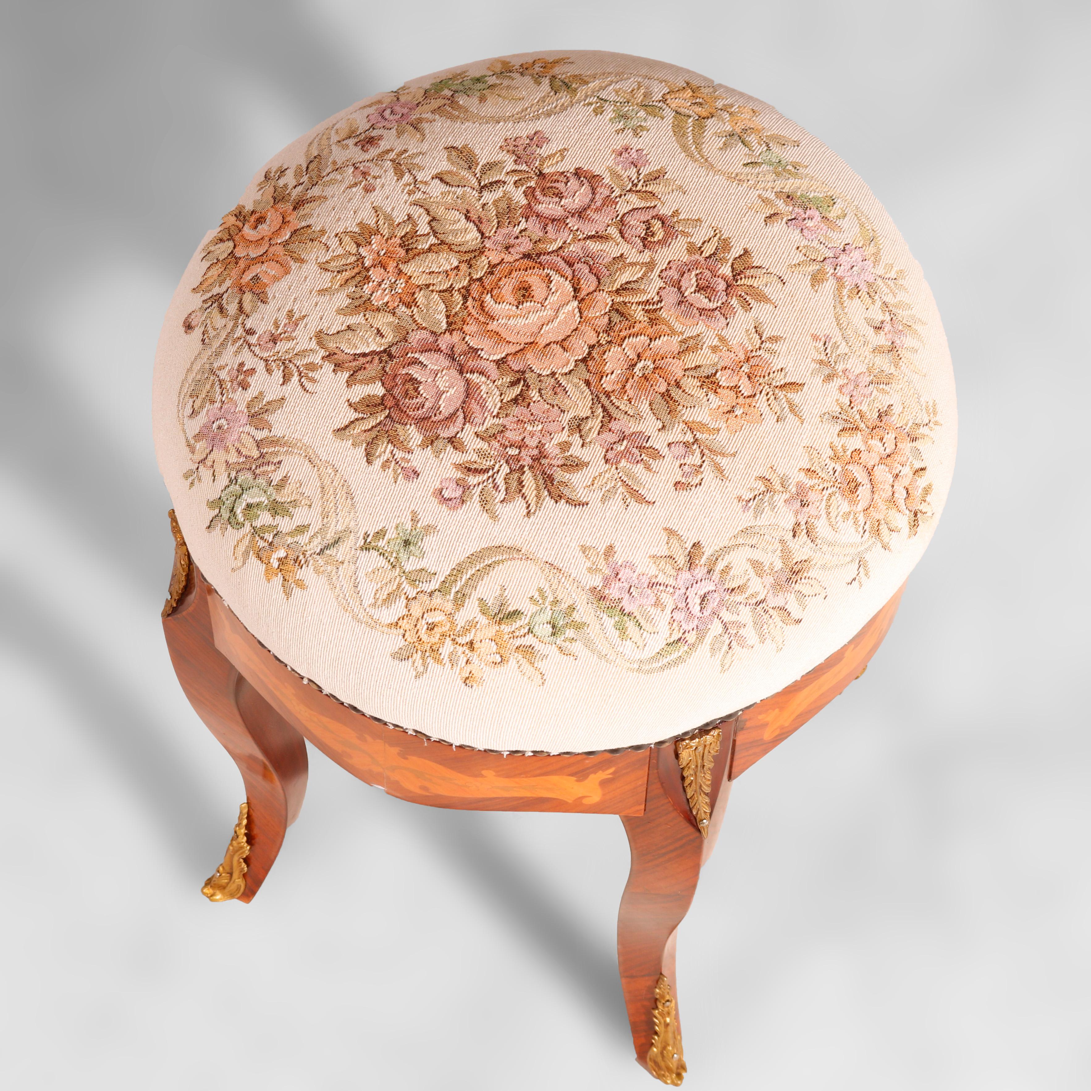 An antique French Louis XIV style stool offers tapestry upholstered seat over kingwood base having satinwood inlay, cast ormolu mounts and raised on cabriole legs, circa 1930

Measures - 19