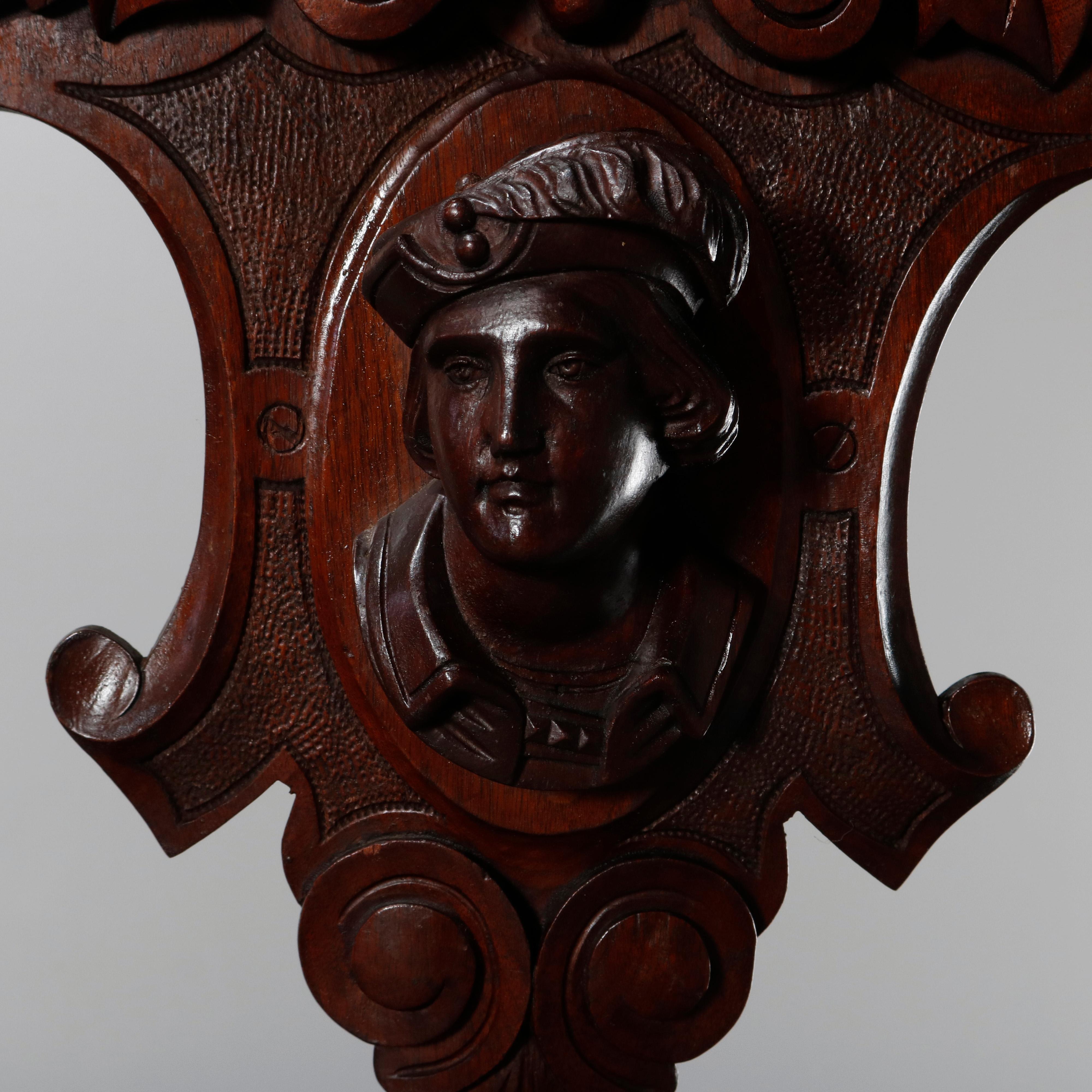 An antique figural Victorian Jelliffe school architectural pediment offers carved walnut in shield form with palmette and foliate scroll crest surmounting central male portrait mask, circa 1870.

***DELIVERY NOTICE – Due to COVID-19 we are employing