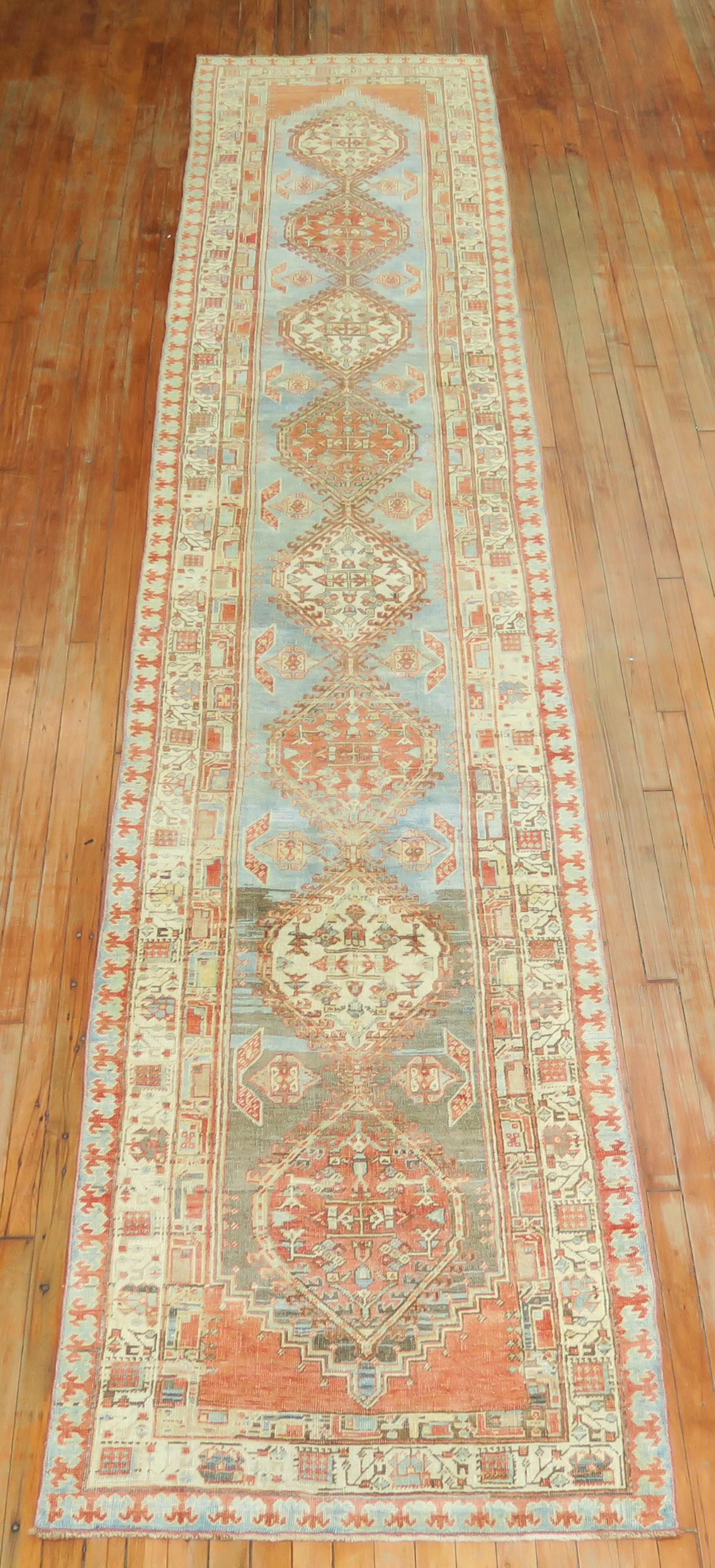 Predominant light blue gray orange Persian tribal geometric runner from the early 20th century. 

Measures: 3' x 15'9