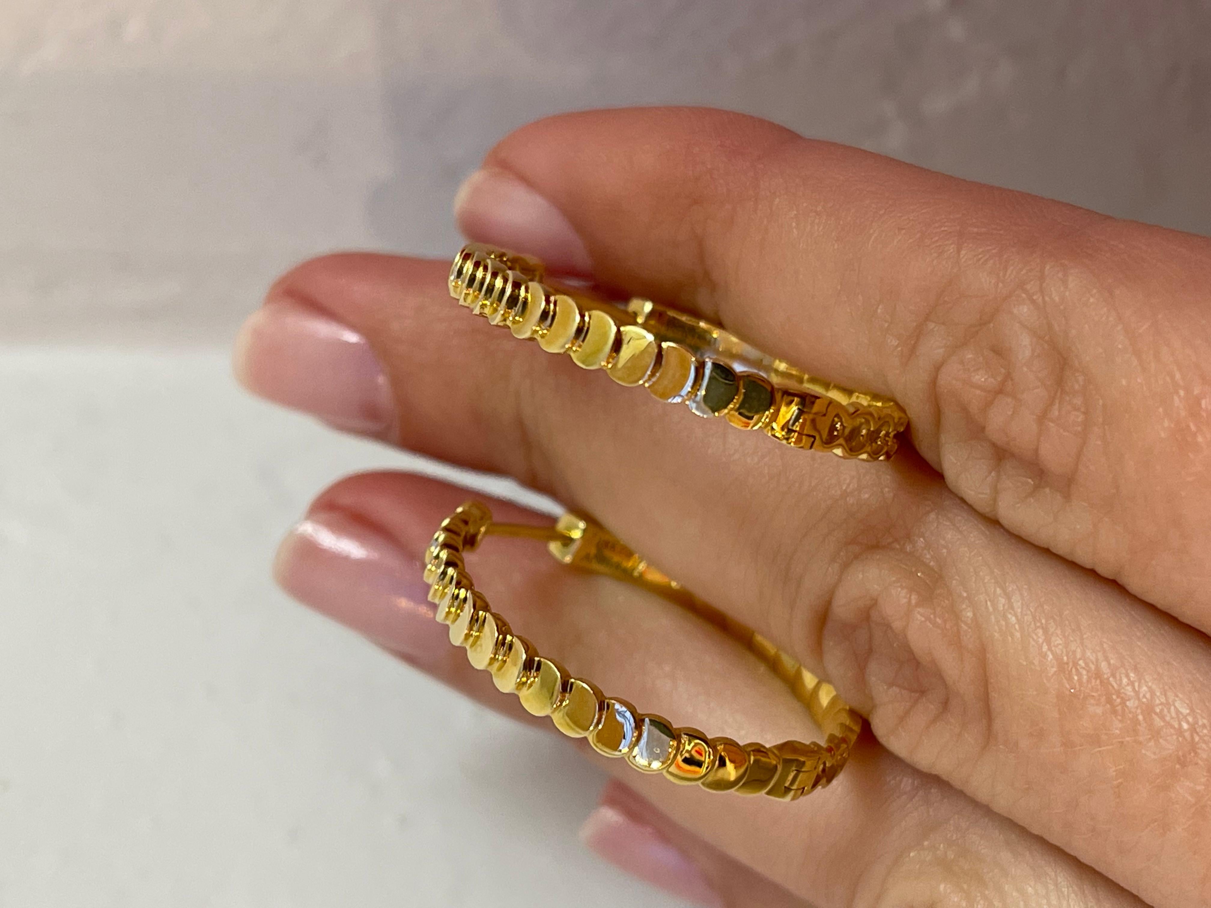 These elegant 18K gold earrings mimic the shape of a crescent moon and are the perfect slender size for day or night. Add to your collection today! 

Style: AKELH-YG

Features:
+ Anita Ko 18K Yellow Gold Luna Hoop Earrings
+ Post and clasp closure
+