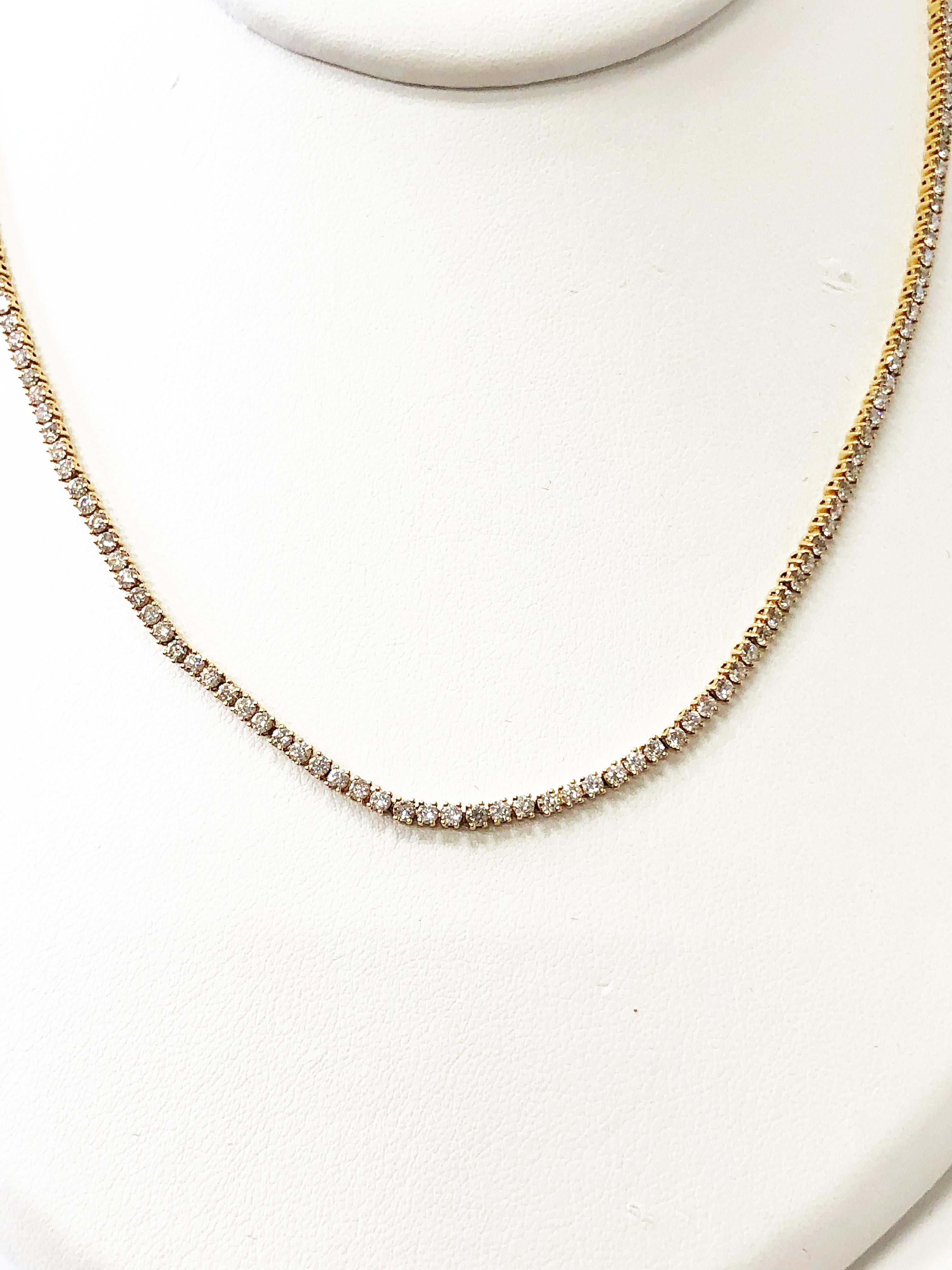 This Anita Ko white diamond round necklace in 18k yellow gold is a classic piece that is a great addition to any jewelry collection.  With 5.46 carats of good quality, white, and bright diamonds, this necklace can be layered or worn on it's own. 
