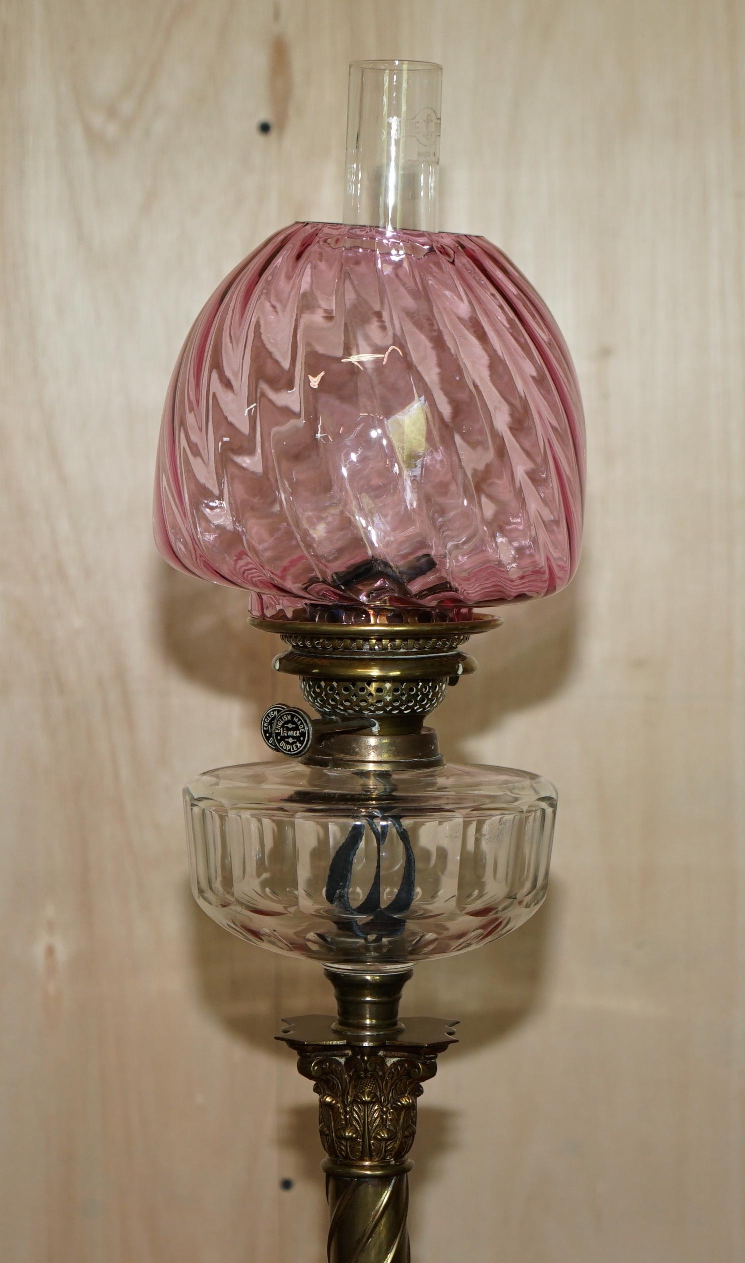 We are delighted to offer this stunning Victorian, spiral Corinthian pillar oil lamp with ruby glass shade

I have a suite of seven Victorian oil lamps, all the others are listed under my other items including one pair

The lamp has a