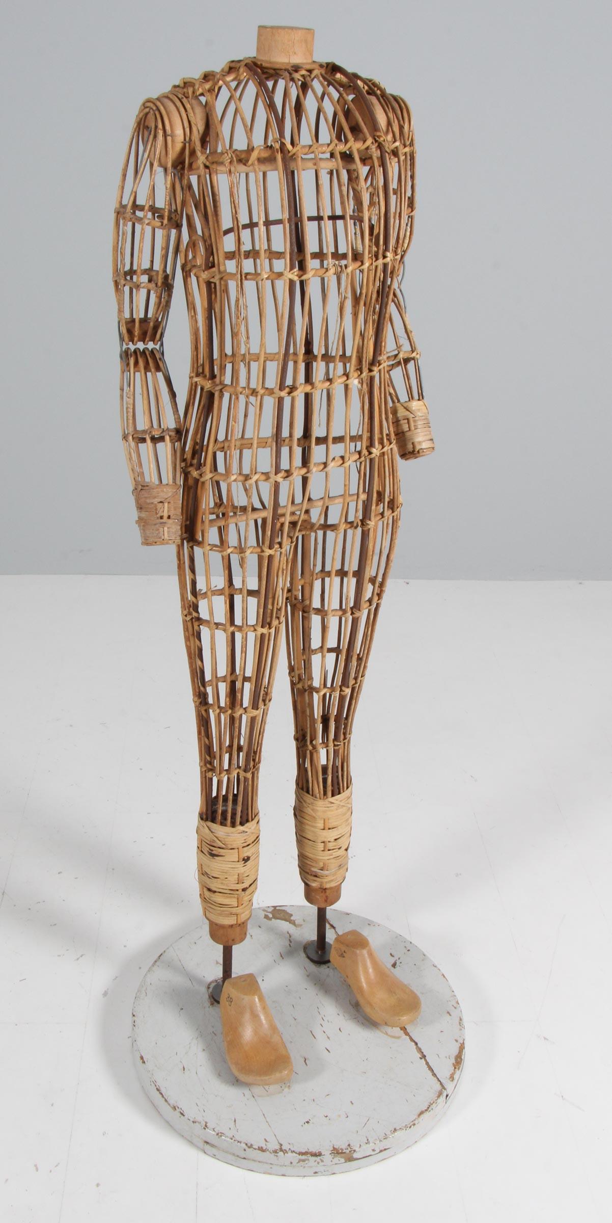 Antique Mannequin made of woven bamboo and cane. Steel frame. Base of solid wood. Later shoe holders mounted.

Fantastic decorative, but still in perfect usable condition.