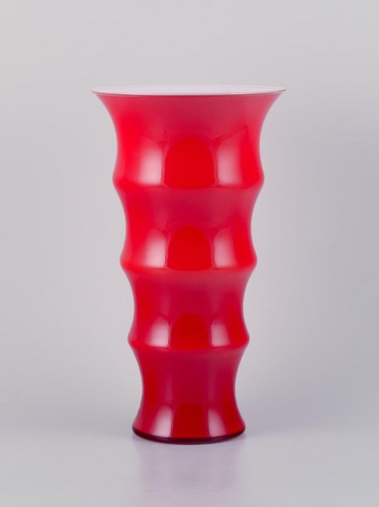 Anja Kjær for Holmegaard.
Large art glass vase in mouth-blown wine-red glass.
Late 20th century.
Stamped.
Perfect condition.
Dimensions: H 31.0 cm x D 17.2 cm.