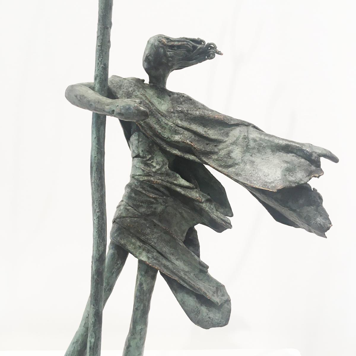 Hold Tight - contemporary figurative standing female bronze sculpture tree windy - Sculpture by Anke Birnie