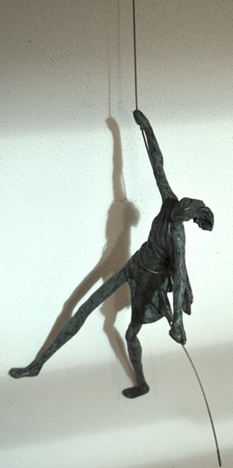 Anke Birnie Figurative Sculpture - Legs on the Wall n.4297 - hanging sculpture human in motion