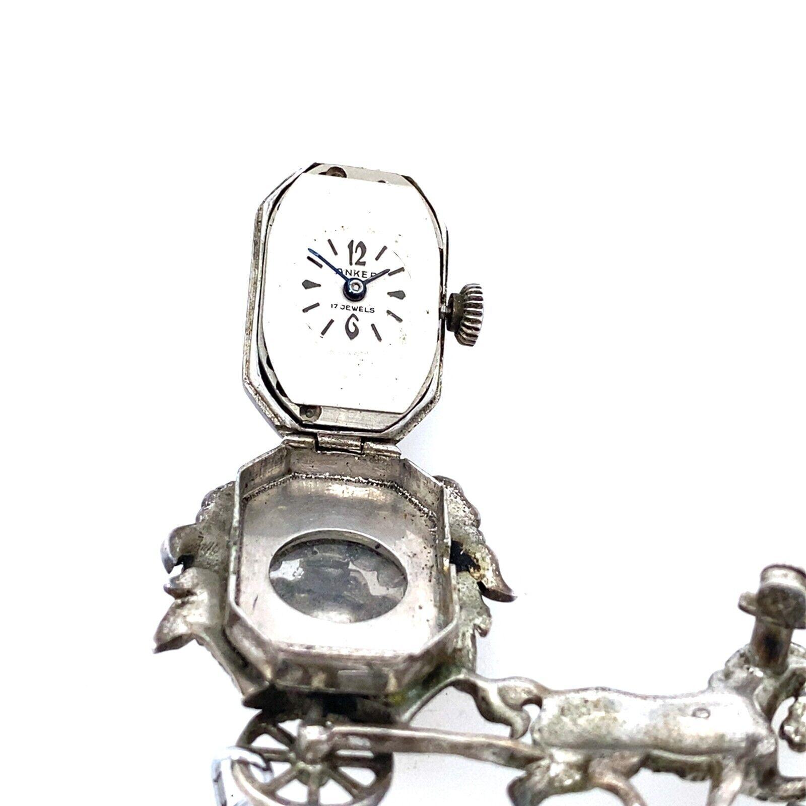This Anker Silver 1950's Horse and Carriage Monarch Brooch/Watch with Marcasite is a vintage piece that is in very good condition, with safety chain. It has the original Anker on the back and is in full working condition.

Additional Information: