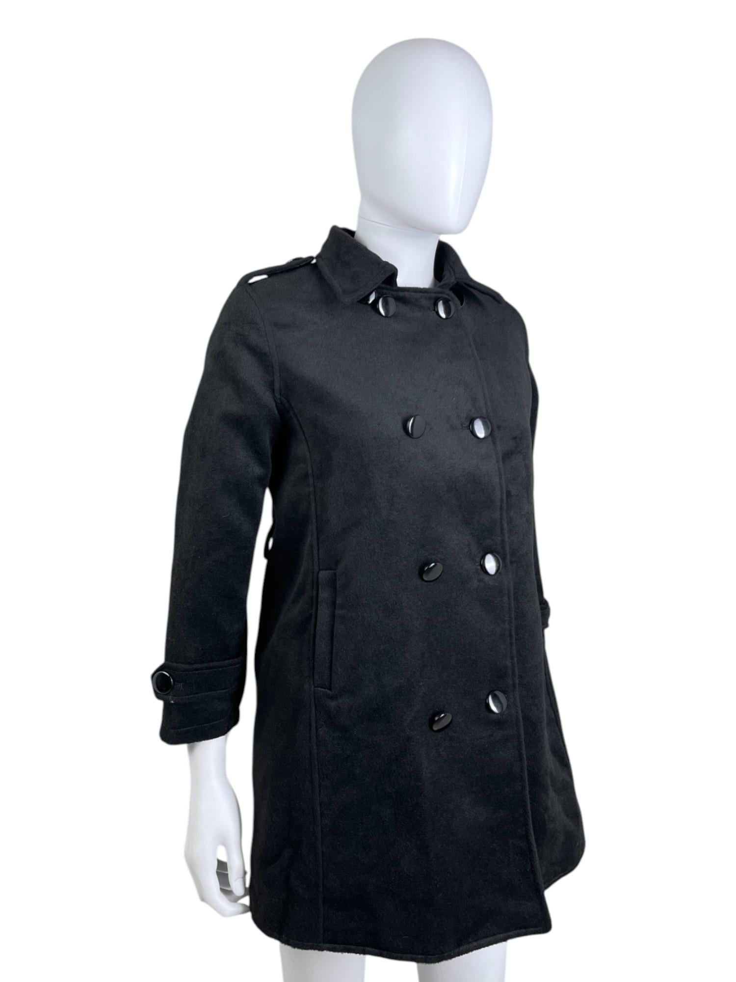 - Designed by Ann Demeulemeester
- Early 00's
- Black Wool Coat
- Double Breasted lucid buttons closure
- Military details on the shoulders
- Buttoned bands at the wrists
- Velvet effect
- Very good condition
- Missing composition label
- Size: L