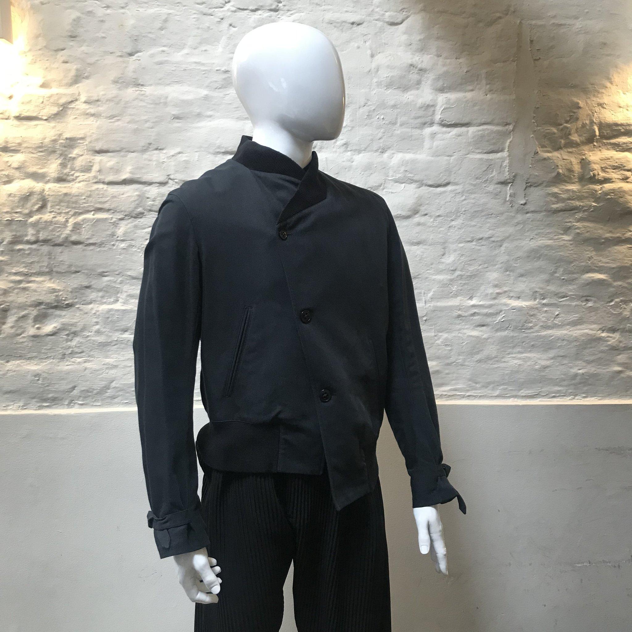 Ann Demeuleemster Asymmetrical Bomber Jacket made in Belgium from cotton. 

Ann Demeulemeester is a fashion house established in 1985 and based in Antwerp, Belgium. Renowned for a poetic balance of shadow and light, the collections for women and men