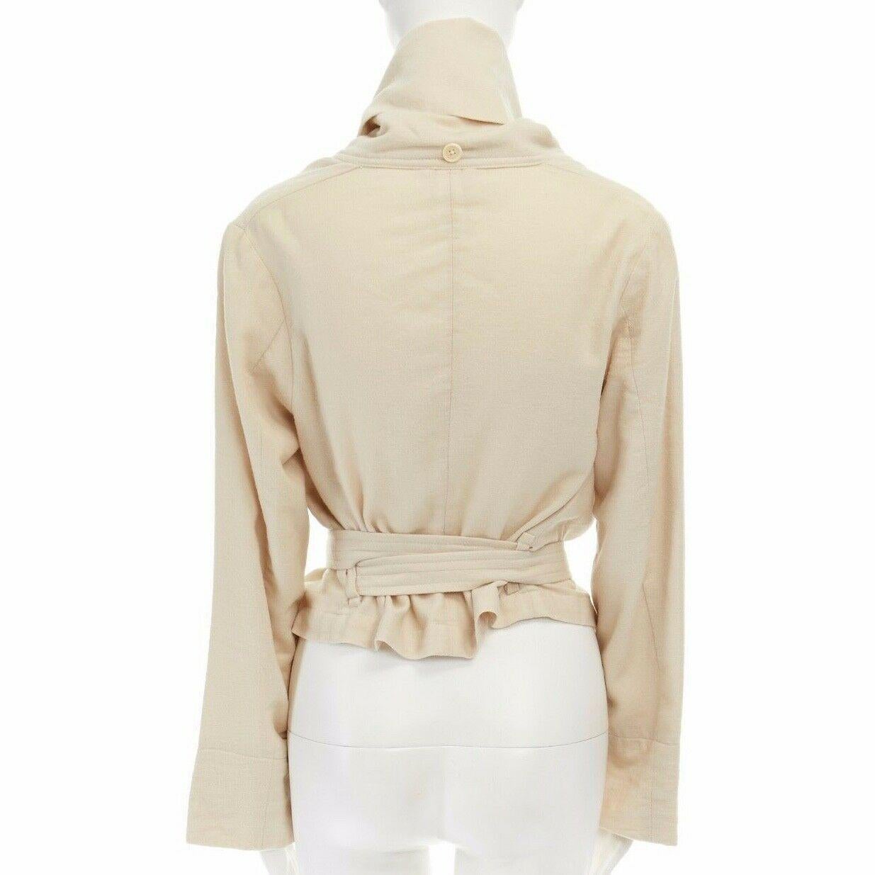 ANN DEMEULEMEESTER beige wool linen draped collar belted oversized jacket FR36 S

ANN DEMEULEMEESTER Wool, linen. Cream. Button front closure. Draped collar. Dual slanted front pocket. Dropped shoulder seam. Loose cut sleeves. Attached belt at back.