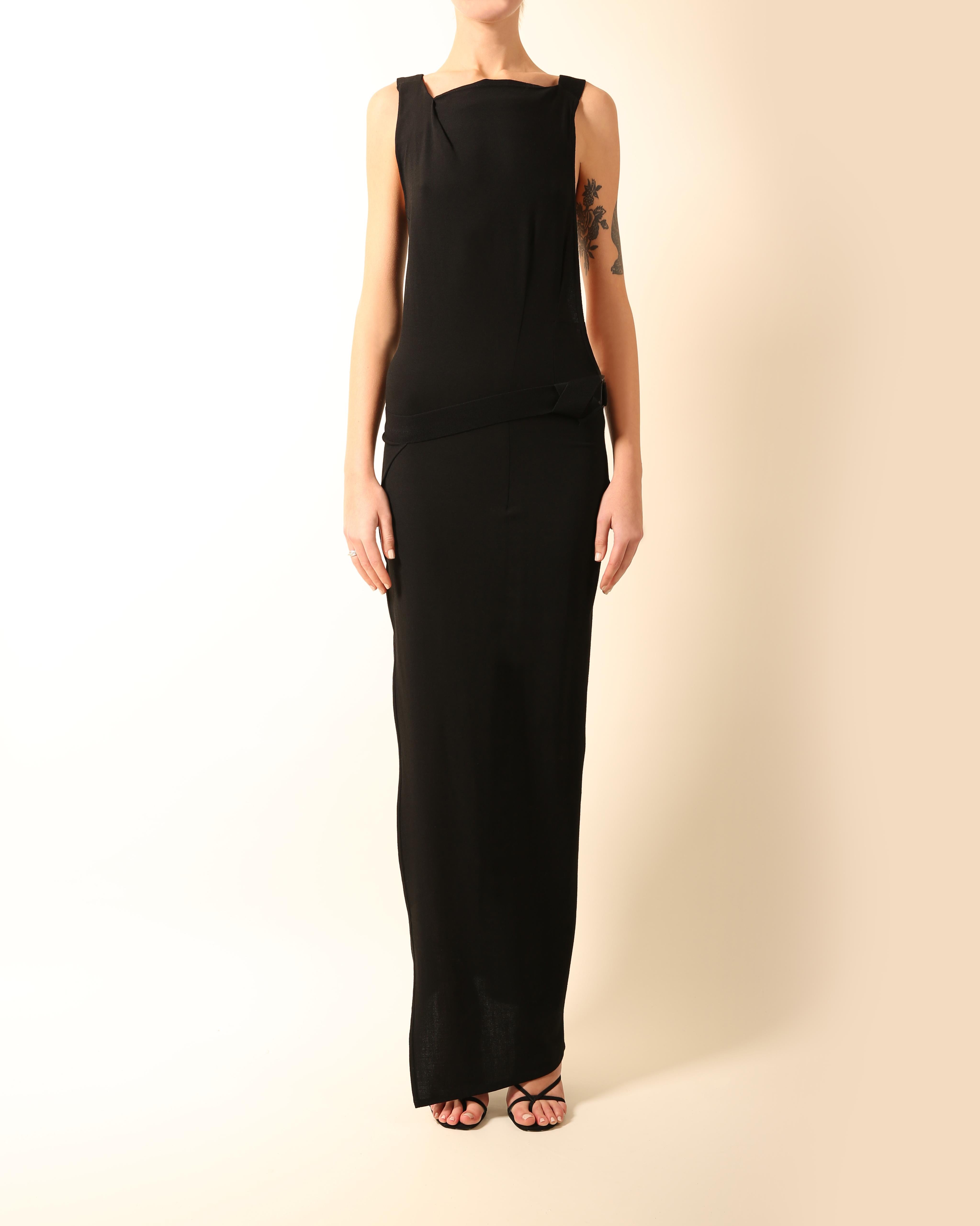 Ann Demeulemeester
Full length black column style dress
Wrap over skirt that fastens via a stretch belt and pull through buckle
Completely backless cut  and sides with a diagonal strap across the back
Stretch fabric
Concealed side zip

FREE SHIPPING