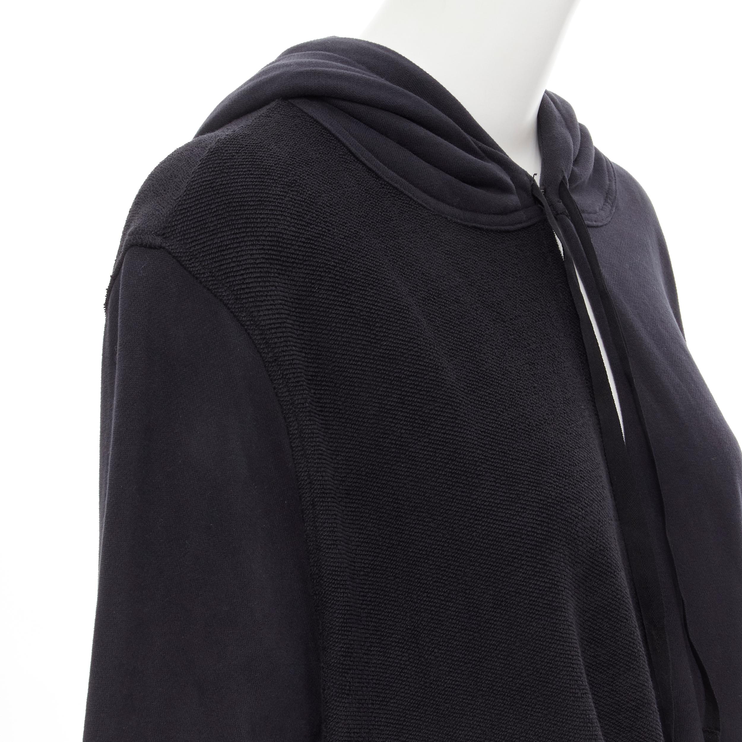 ANN DEMEULEMEESTER black cotton jersey split twist deconstructed hoodie FR34 XS 
Reference: MELK/A00030 
Brand: Ann Demeulemeester 
Material: Cotton 
Color: Black 
Pattern: Solid 
Closure: Hook & Eye 
Extra Detail: Twisted design. Split front and