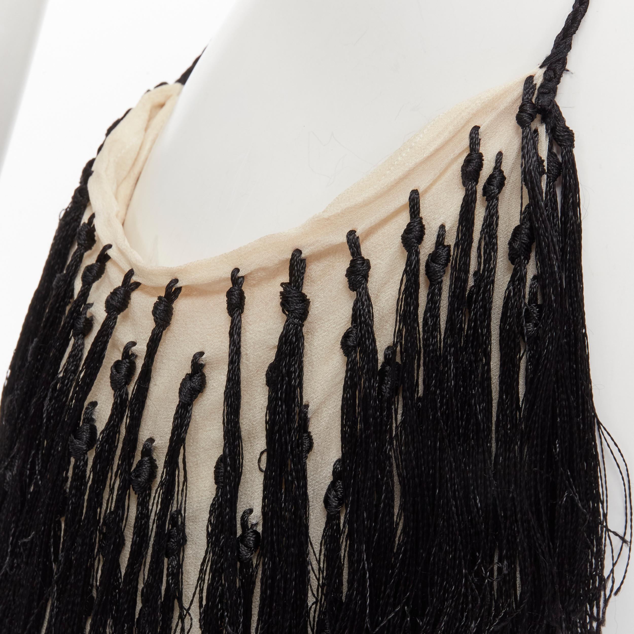 ANN DEMEULEMEESTER black fringe tassel embellished silk pouch crossbody bag 
Reference: TGAS/B02112 
Brand: Ann Demeulemeester 
Material: Silk 
Color: Black 
Pattern: Solid 
Closure: Button 
Extra Detail: Button closure and wall pocket at interior.