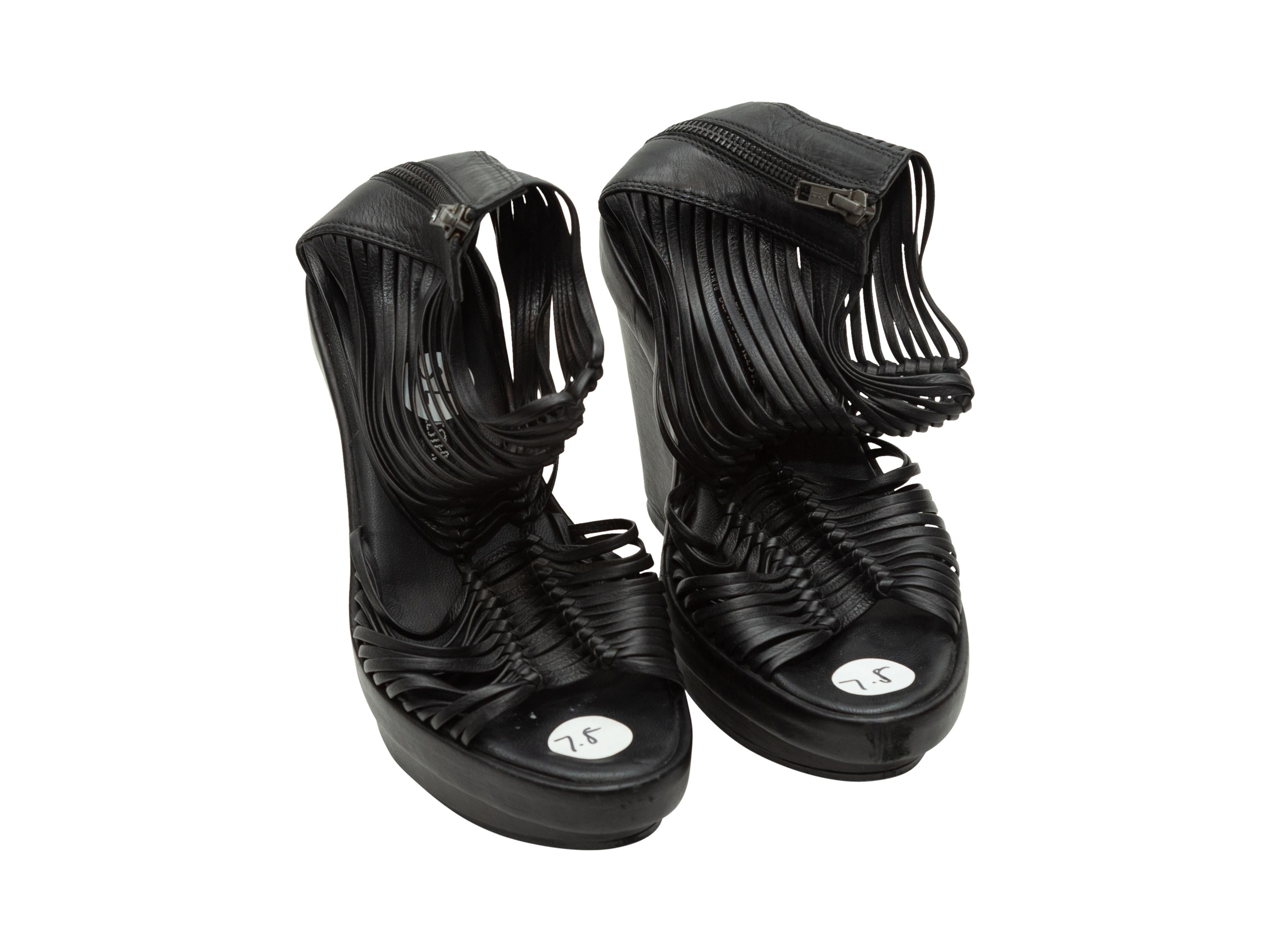 Product details: Black leather cage sandals by Ann Demeulemeester. Wedge heels. Zip closures at backs. Designer size 37.5. 5