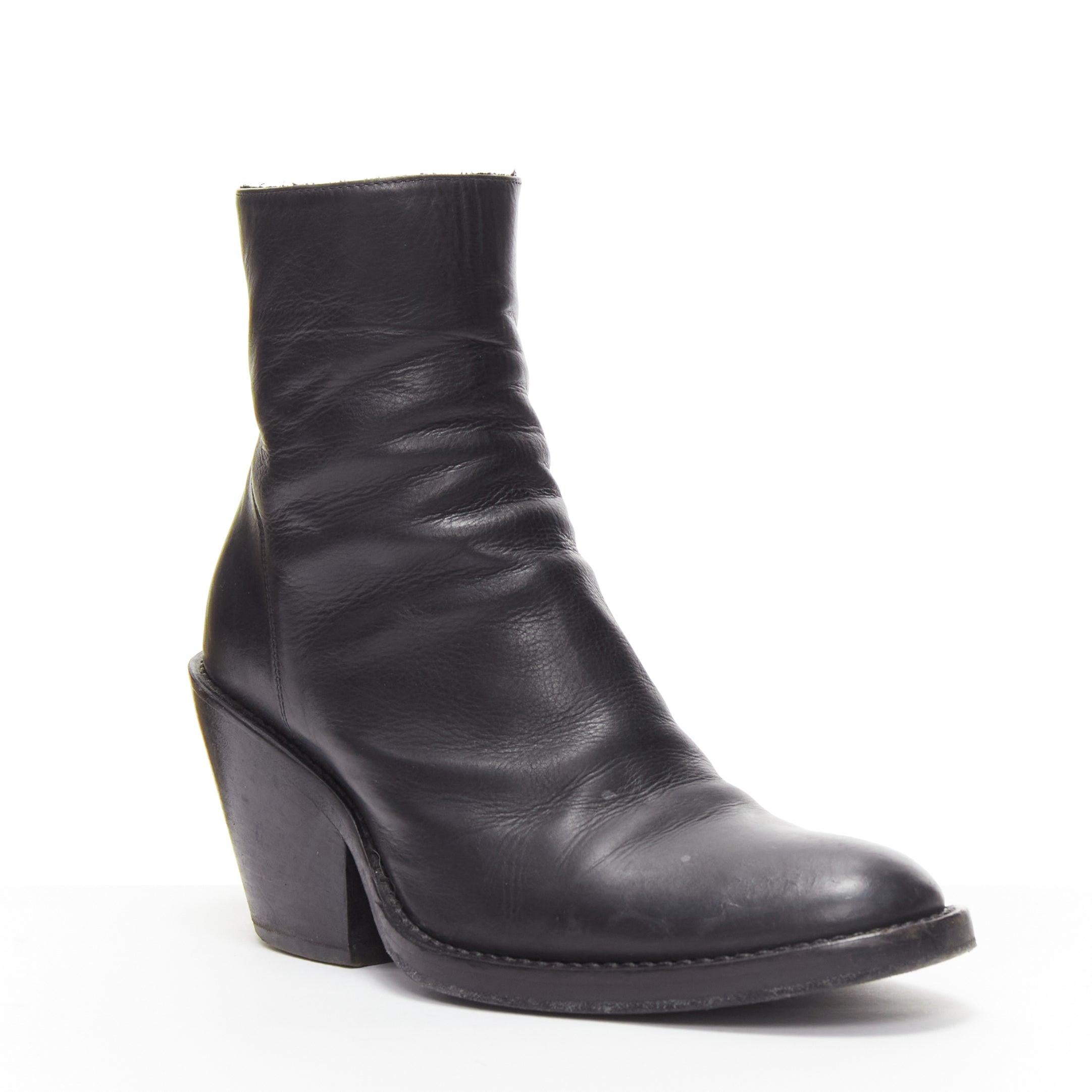 ANN DEMEULEMEESTER black leather round toe cuban wooden heel ankle boot EU36
Reference: JACG/A00093
Brand: Ann Demeulemeester
Material: Leather, Wood
Color: Black
Pattern: Solid
Closure: Zip
Made in: Italy

CONDITION:
Condition: Very good, this item