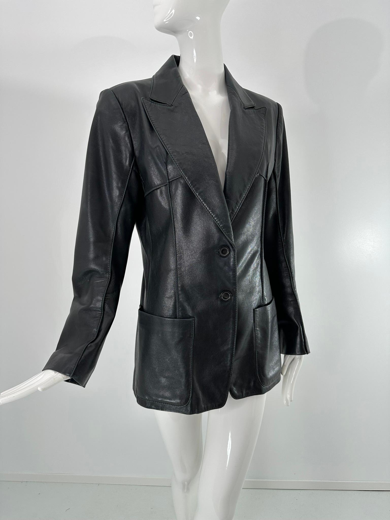 Ann Demeulemeester soft black lamb leather jacket. Blazer style jacket, 2 button front, notched lapel with two hip front patch pockets. Princess seams, the jacket has raised seams with top stitching, giving it a more avant garde look. Long sleeves