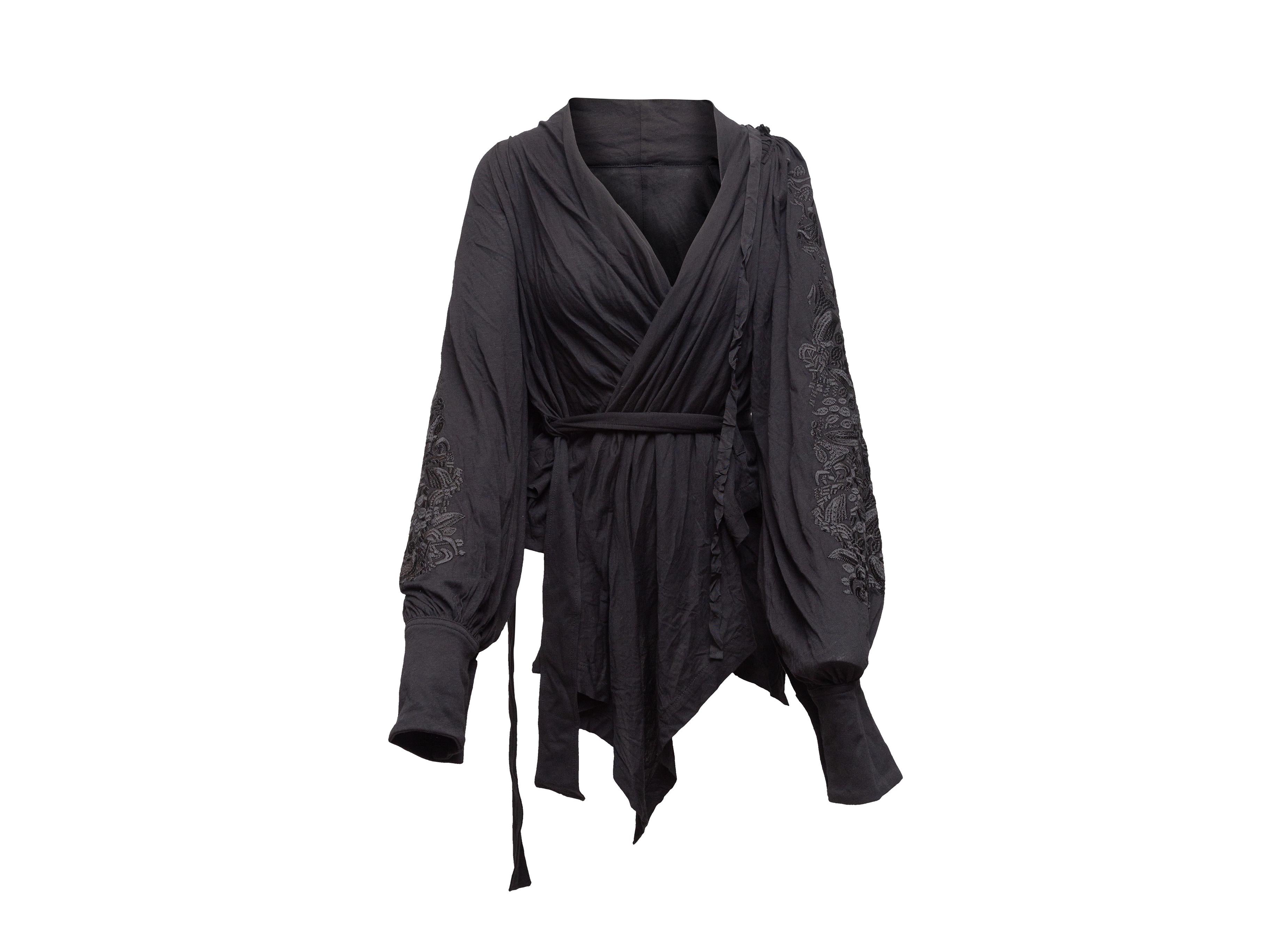 Product details: Black long sleeve wrap blouse by Ann Demeulemeester. Surplice neckline. Embroidery at sleeves. Asymmetrical hem. Sash tie at waist. Designer size 36. 36