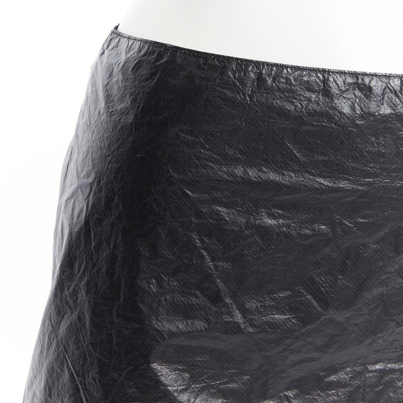 ANN DEMEULEMEESTER black polyethylene plastic bin bag mini skirt FR38 M 
Reference: TGAS/A03272
Brand: Ann Demeulemeester
Designer: Ann Demeulemeester
Material: Polyester 
Color: Black
Pattern: Solid
Closure: Zip
Extra Detail: High waisted