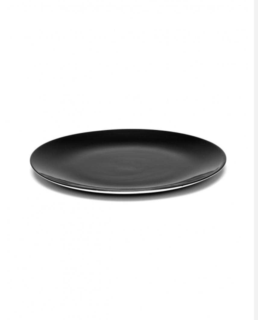 A set of two black Ann Demeulemeester porcelain plates.